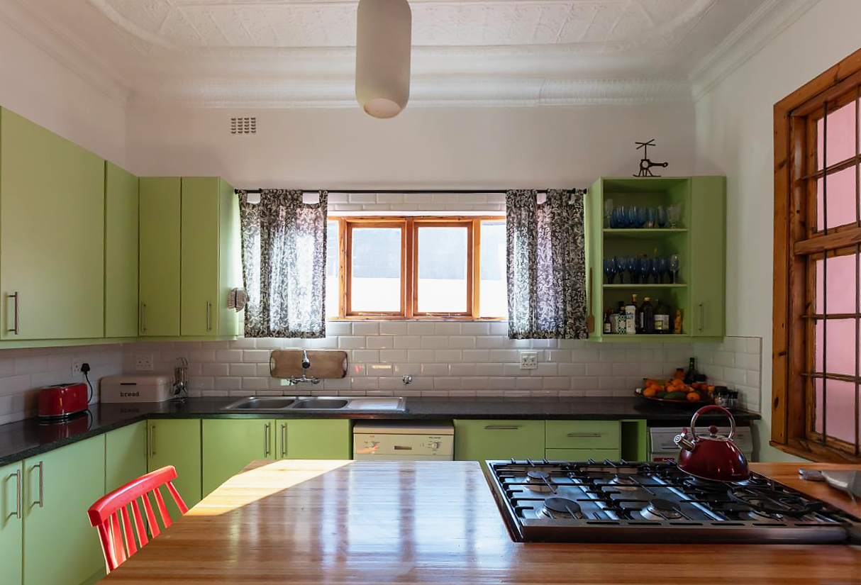 The existing kitchen cabinets were painted the same mint green as the cottage