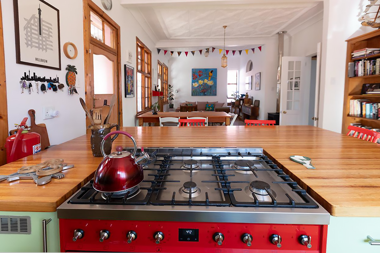 The renovation merged three smaller rooms to create a comfortable and fun living space