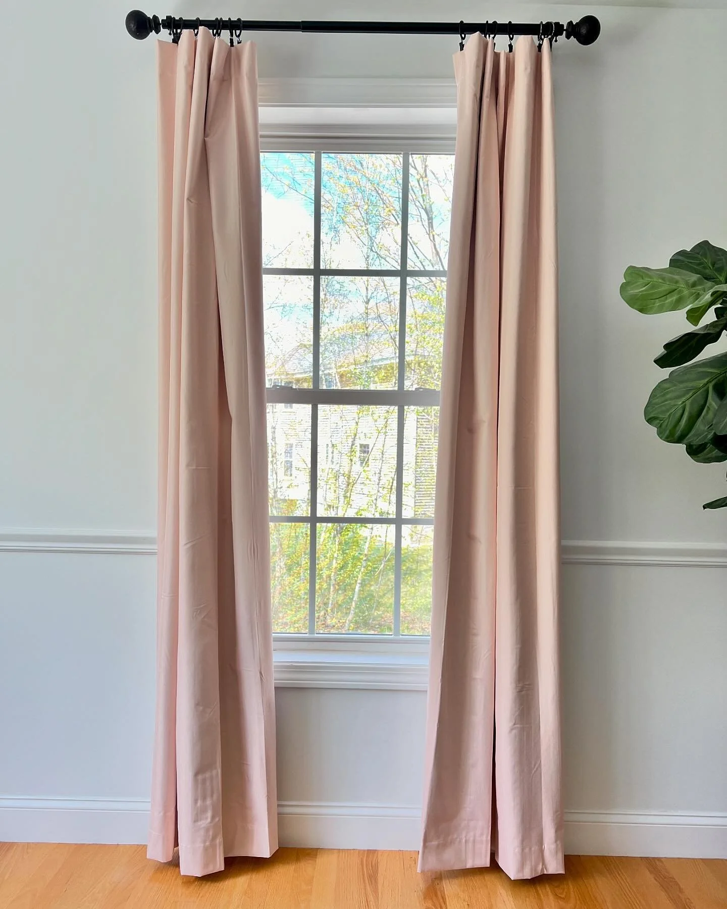 [ DESIGN TRICK ] :: 
When it comes to hanging curtains don&rsquo;t cover up your windows! The way you hang them can trick the eye!
Hang the rod past the window casing (not right to it) and slide a few tabs or rings on the outside of the bracket!
See 