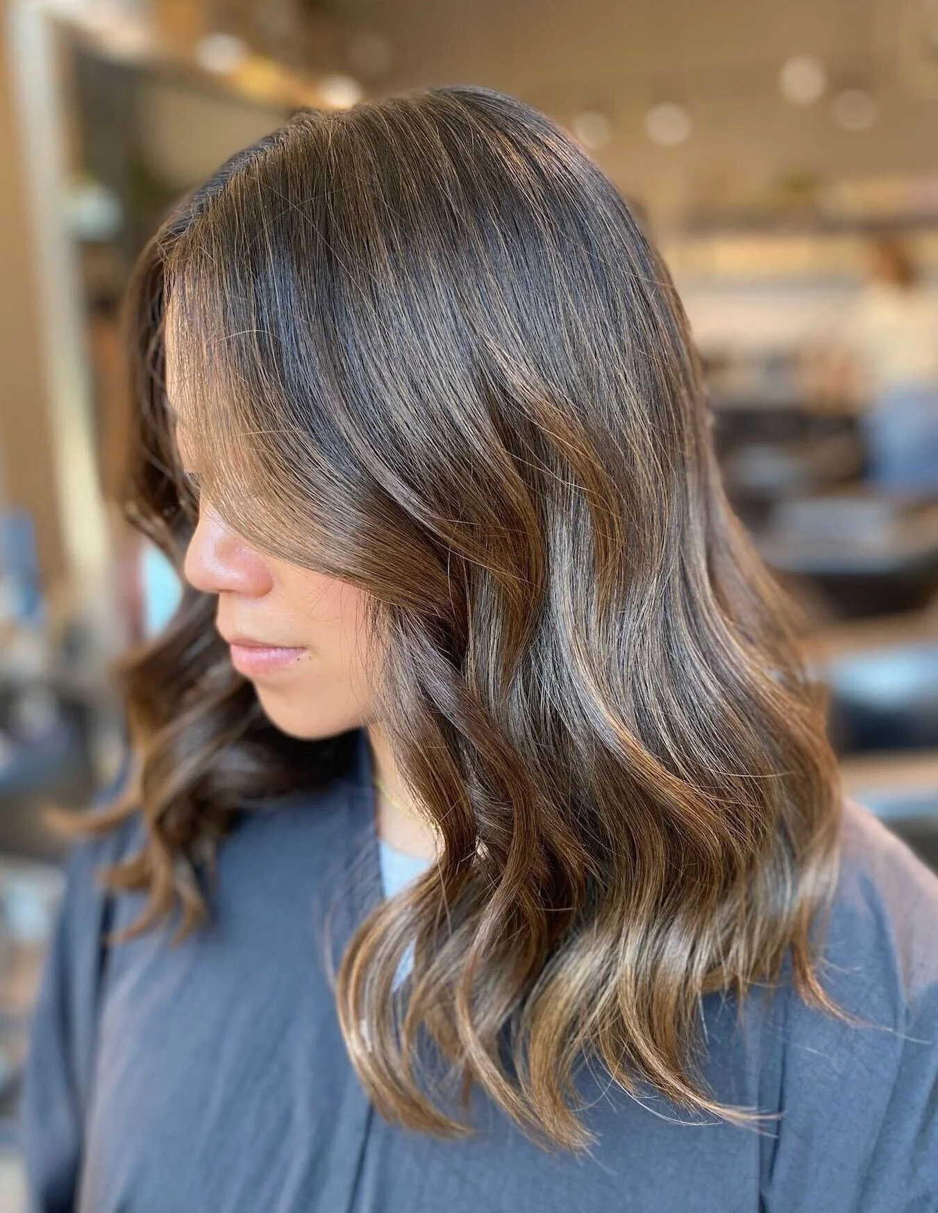 Effortless brunette dimension added through a strategically placed Partial Lived-In Color Session at The Gilded Lily Chicago.