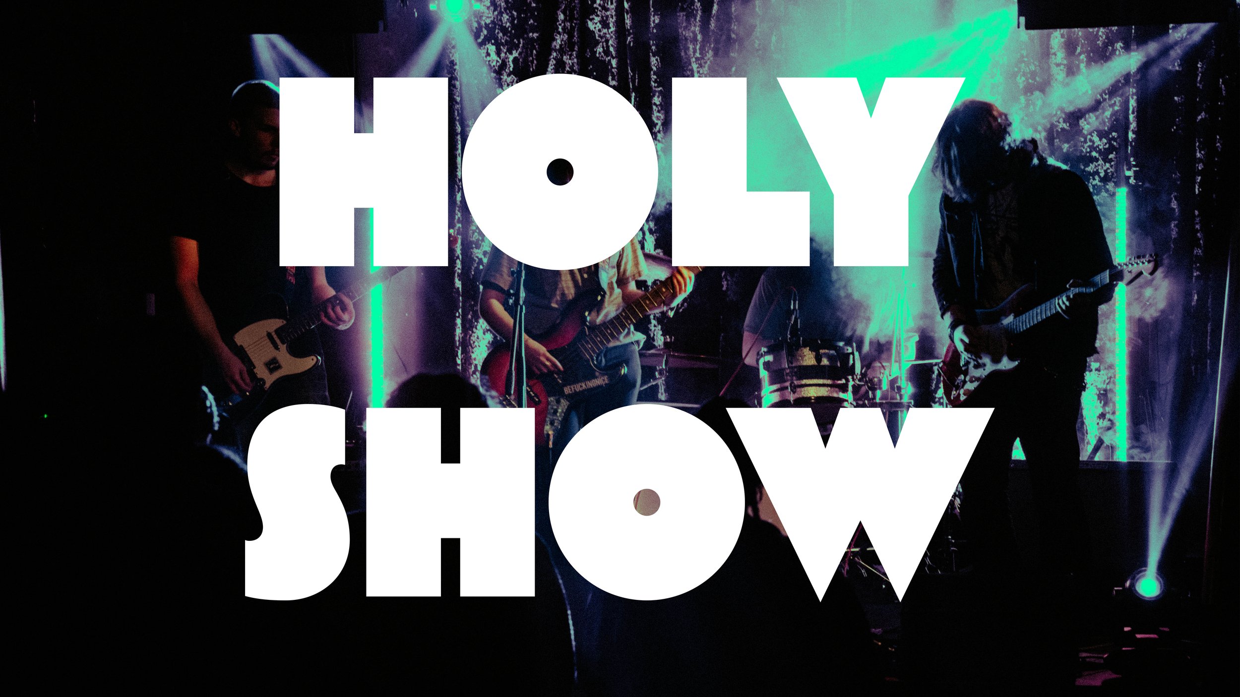 A band performing on stage with colorful lighting, overlaid with large white text that reads 'HOLY SHOW'.