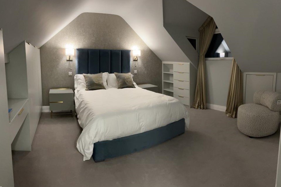 Attic bedroom, curtains open.jpg