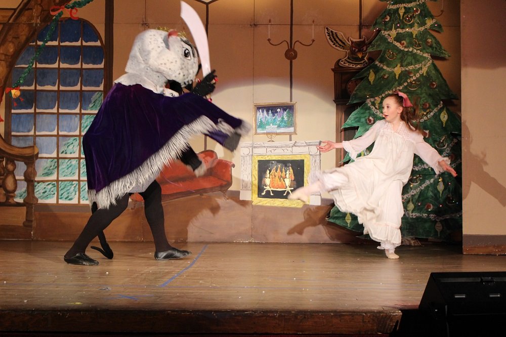 The Mouse King is trying to attack Clara.