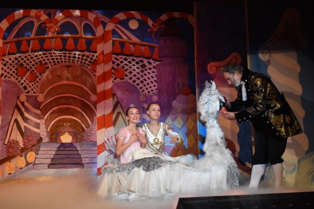 Clare and the Prince ride in the swan boat.
