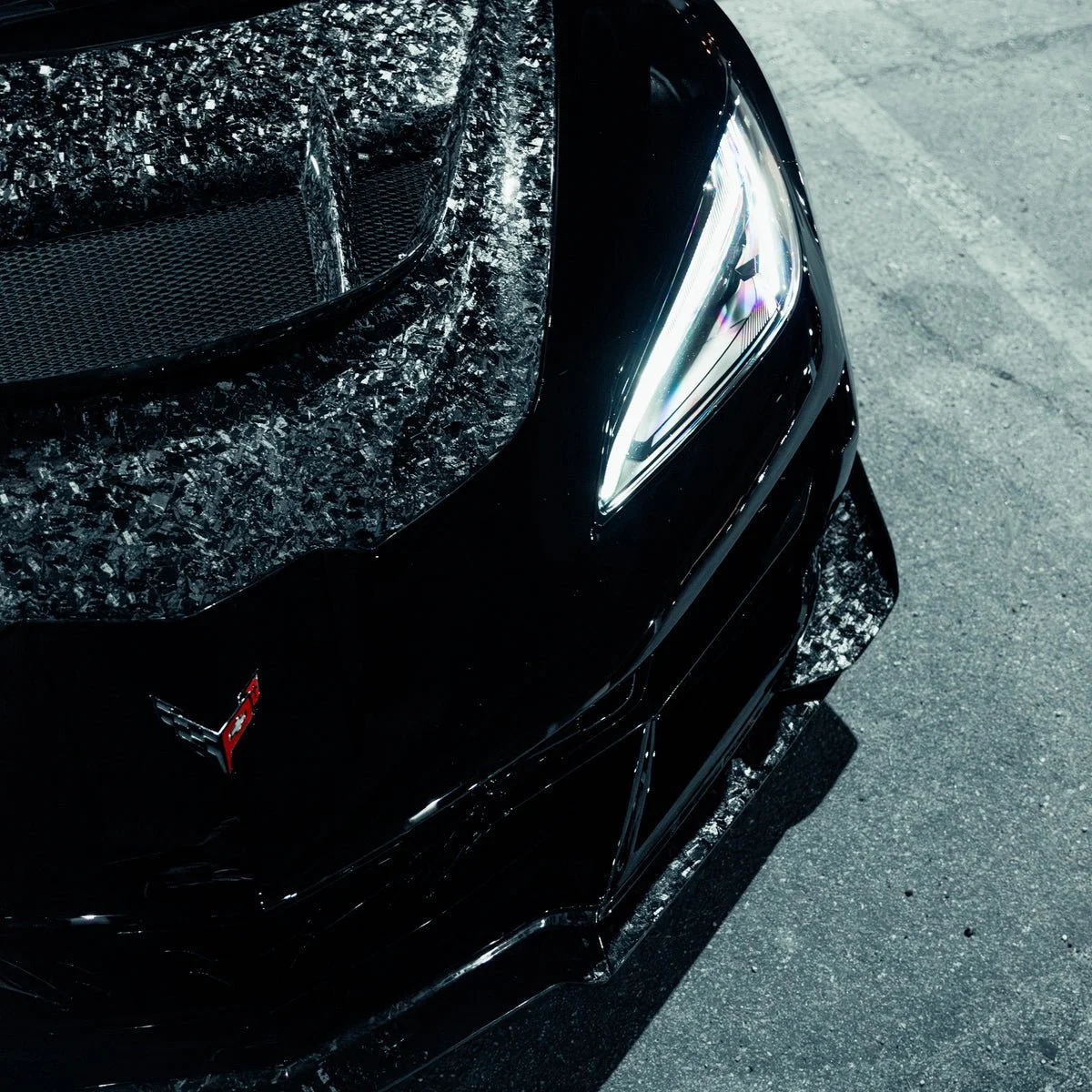 Close_up_forged_carbon_front_splitter_edge_detail_for_C8_Corvette_ZR1_ZTK_kit.jpg