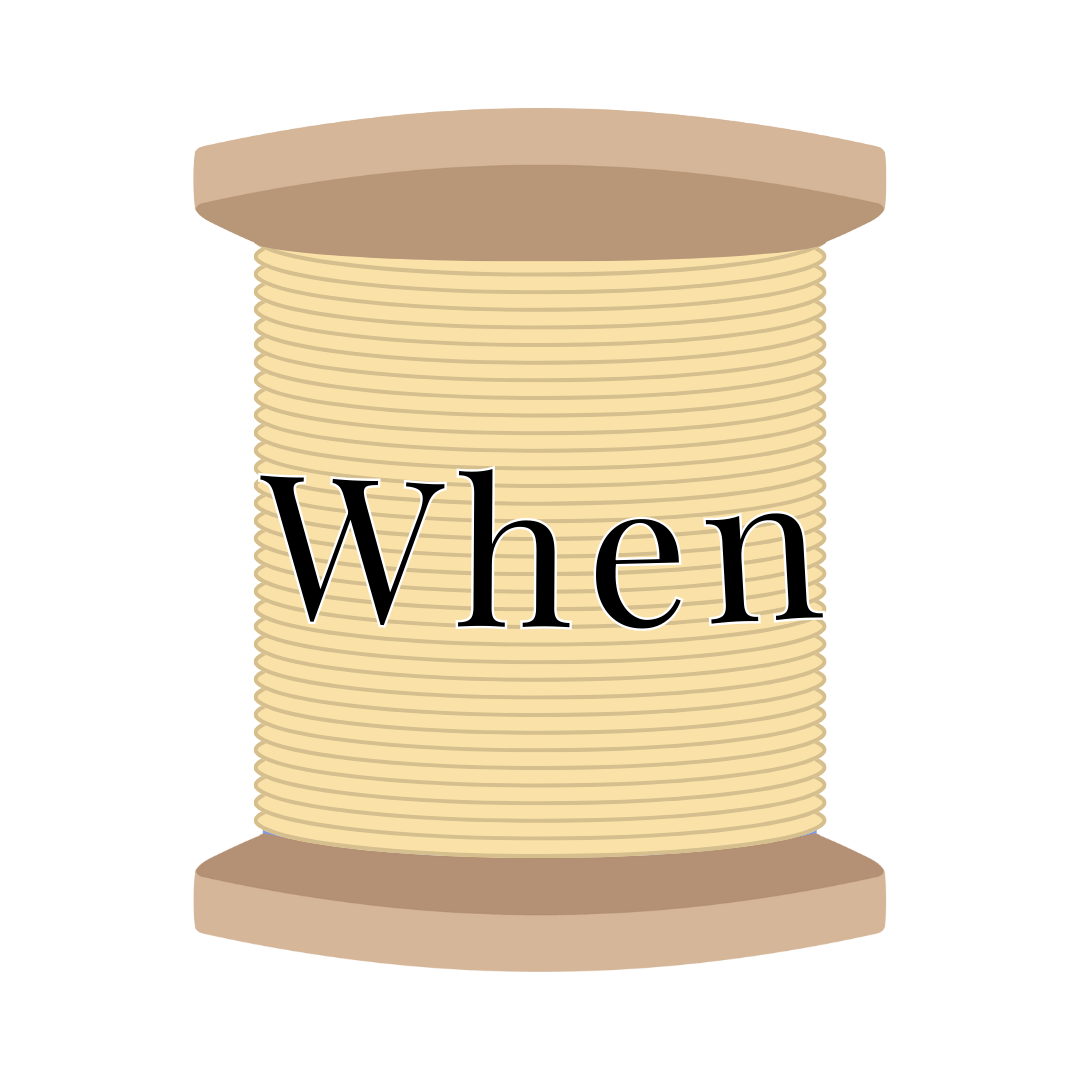 A spool of beige embroidery thread with the word 'When' written across it.