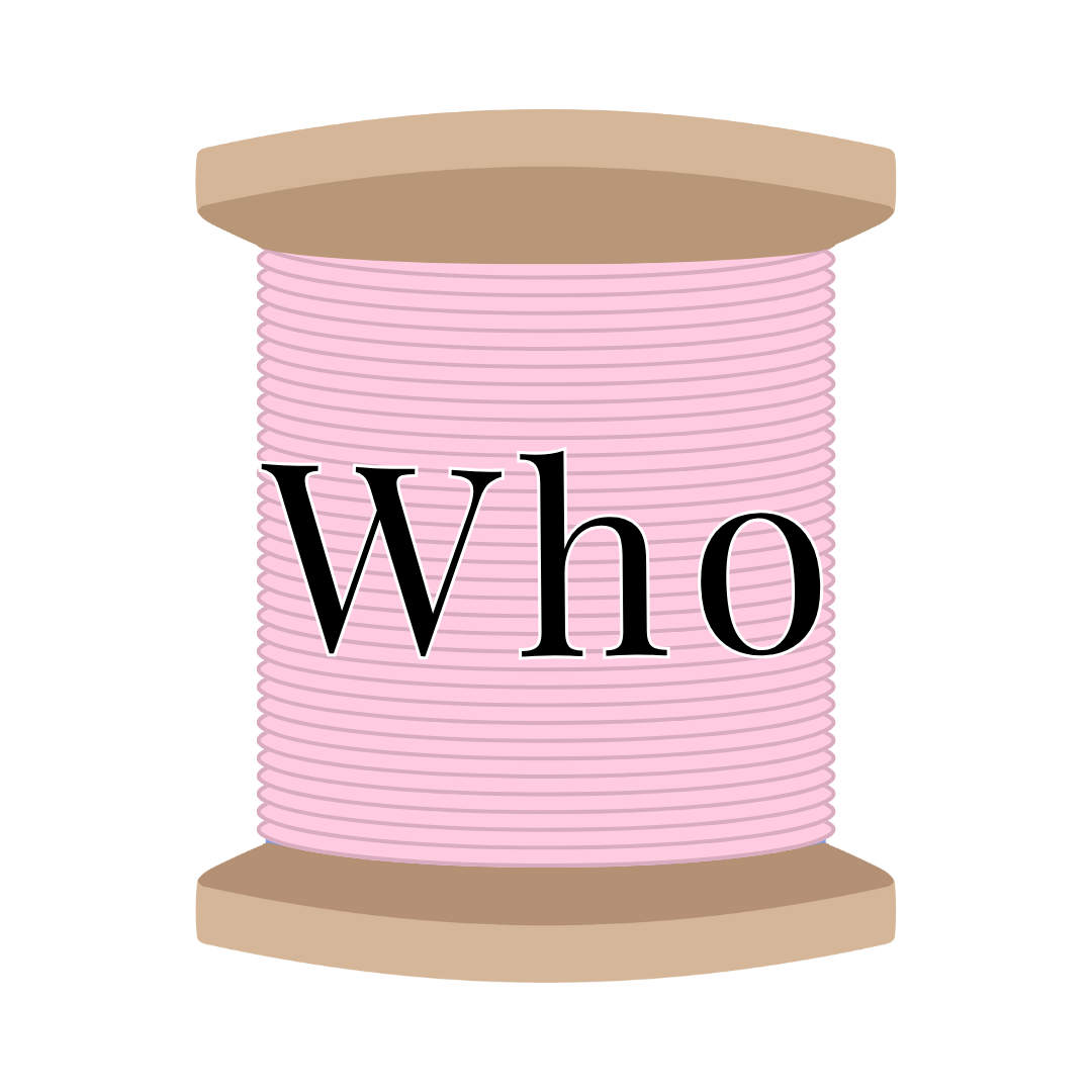 A spool of pink thread with the word 'Who' written on it.