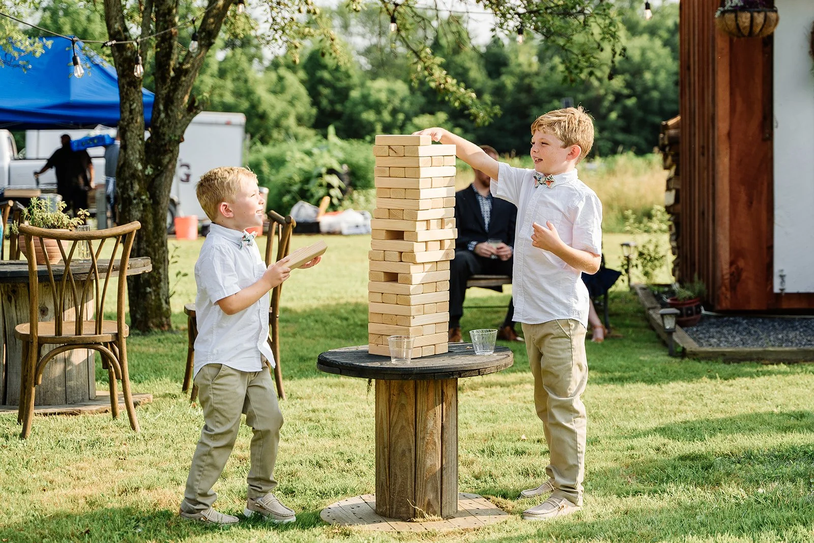 two little boys playing giant jenga at black walnut farm