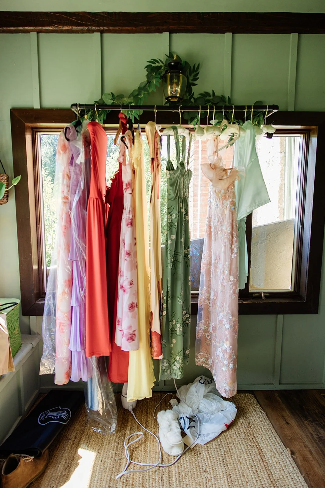 A rack of colorful bridemaid dresses at Black Walnut Farm