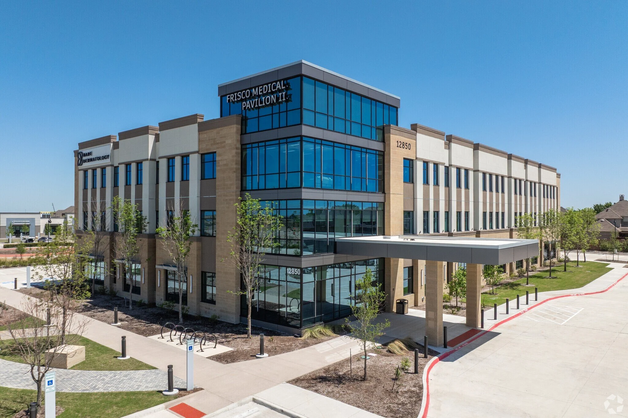 medical office building exterior with landscaping and driveway