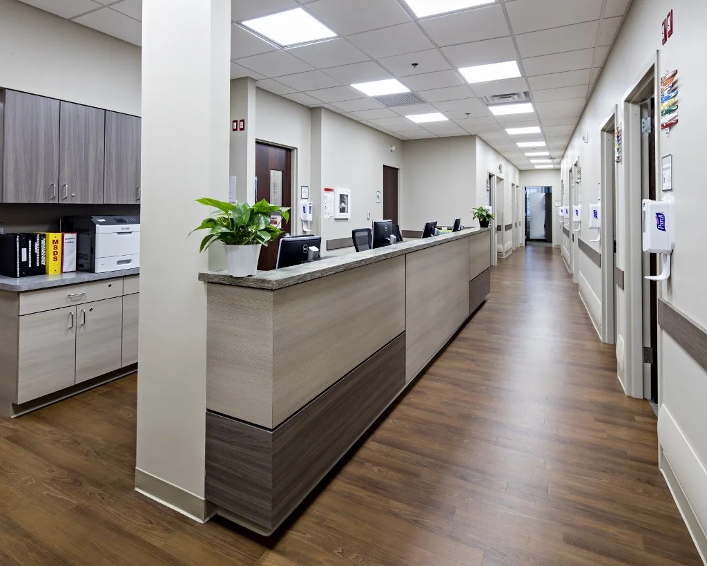 medical clinic interior with nurses station and exam rooms