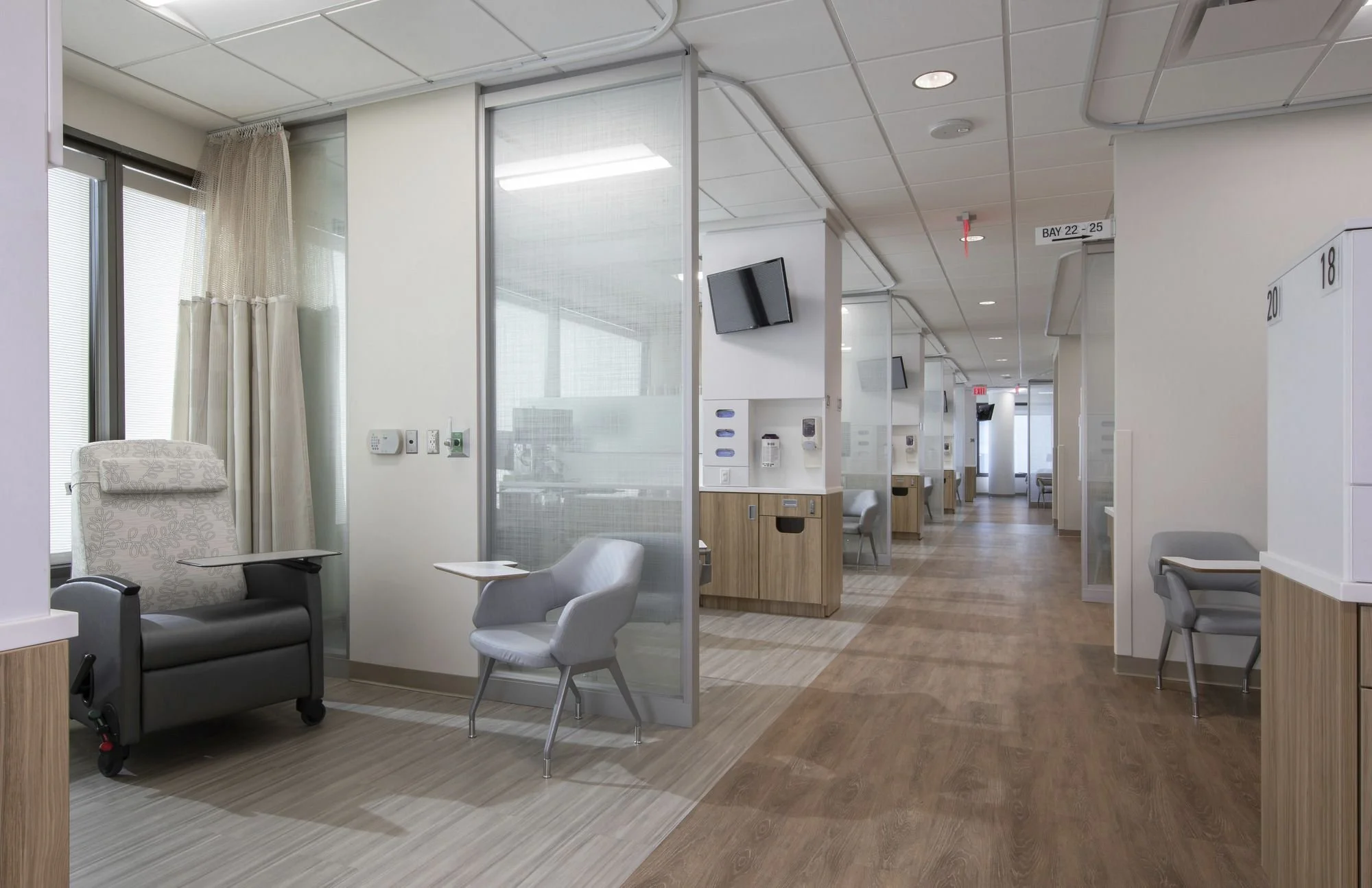 interior of a medical clinic with exam rooms and chairs
