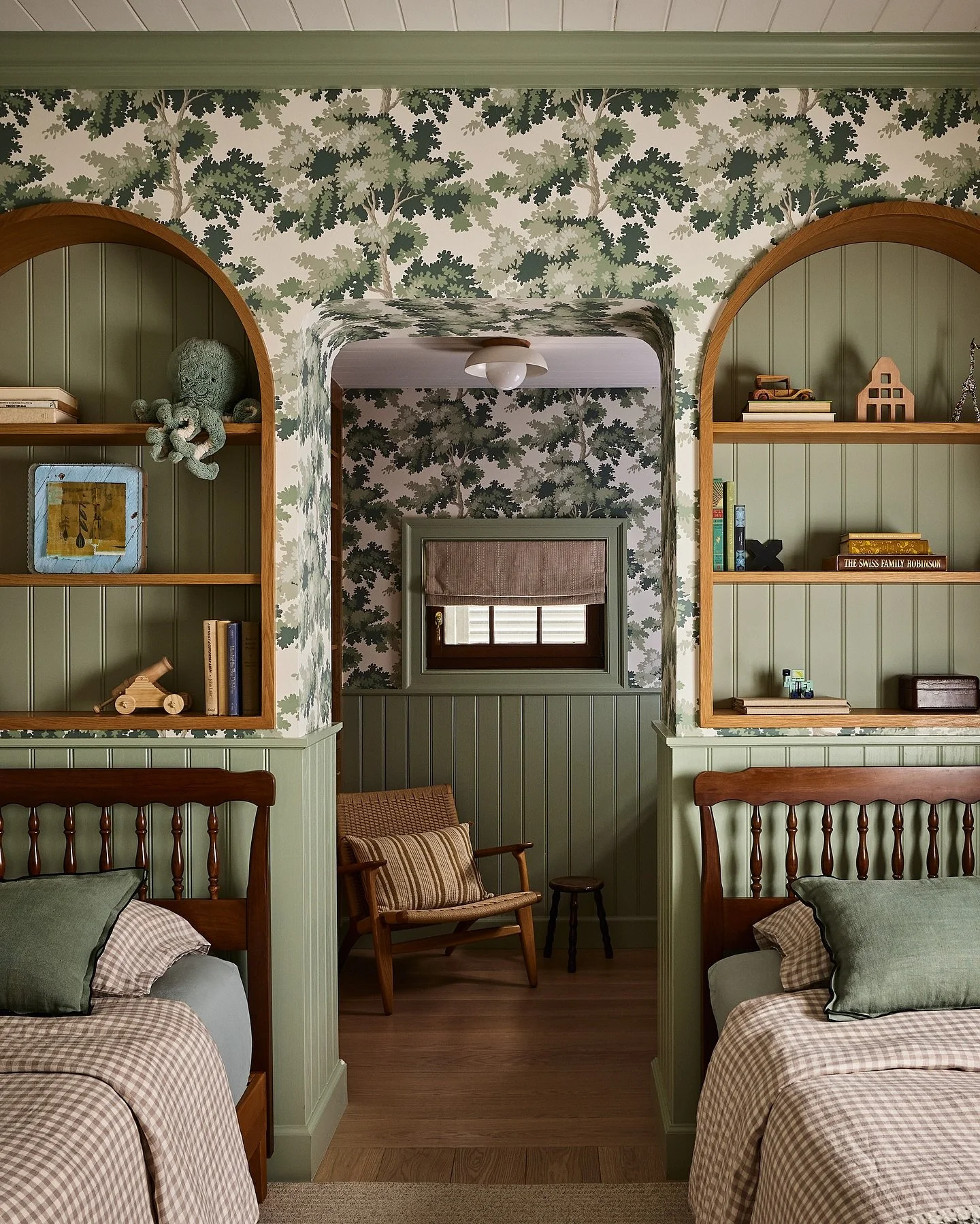 Kids rooms are so fun to design. 

With a growing family, we punched through the back wall to create more space for 2 boys to share this bedroom and allow for adequate storage.

The bookcase niches were added to keep their favorite items close by. An