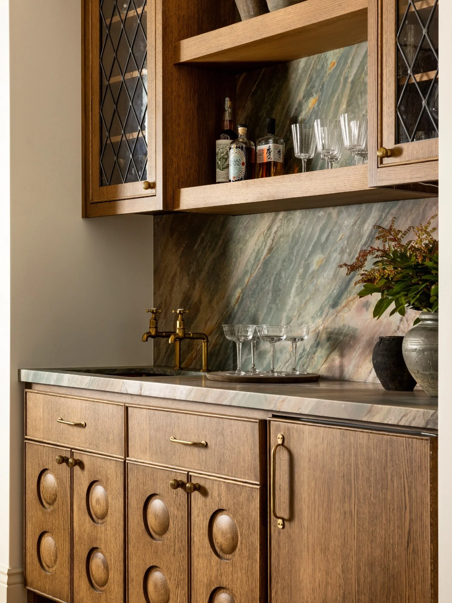 Nothing to do with Halloween. Just a wet bar that makes me want to pour a cocktail after a long week! 

Also, a moment of appreciation for these clients who shared our love for unique stone and bespoke design details, like the leaded glass and carved