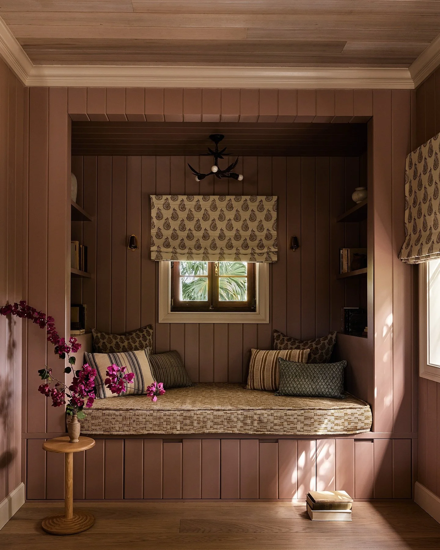 This reading nook used to be a bathroom, connected to a guest room. 

A key element of the renovation for this home was to add a Family room, since the home was lacking a room where the whole family (5 boys) could watch TV, play games, read, and rela
