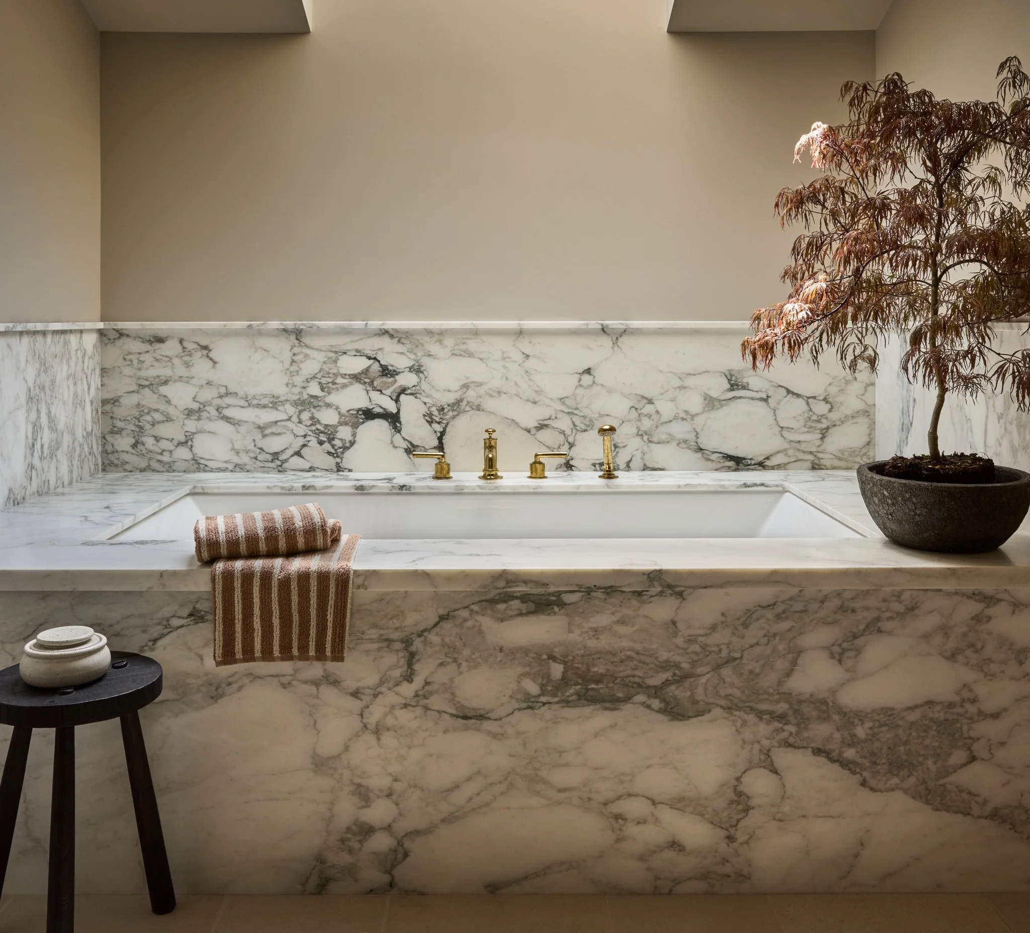We are currently designing a house on the Oregon coast with 7 bathrooms. Seven! So I&rsquo;ve bathroom materials on my mind. 

Here is a soaking tub we designed for our Dry Creek project that has the best light, wrapped in a beautiful Calacutta Vagli