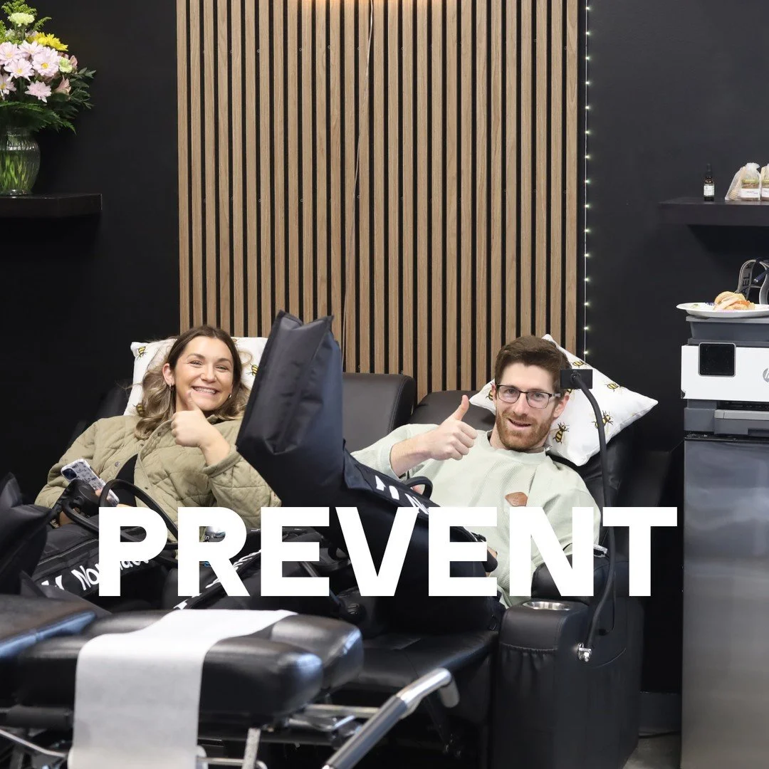 PREVENT: two patients relaxing in recliners in the Health Hive treatment room, one giving a thumbs up