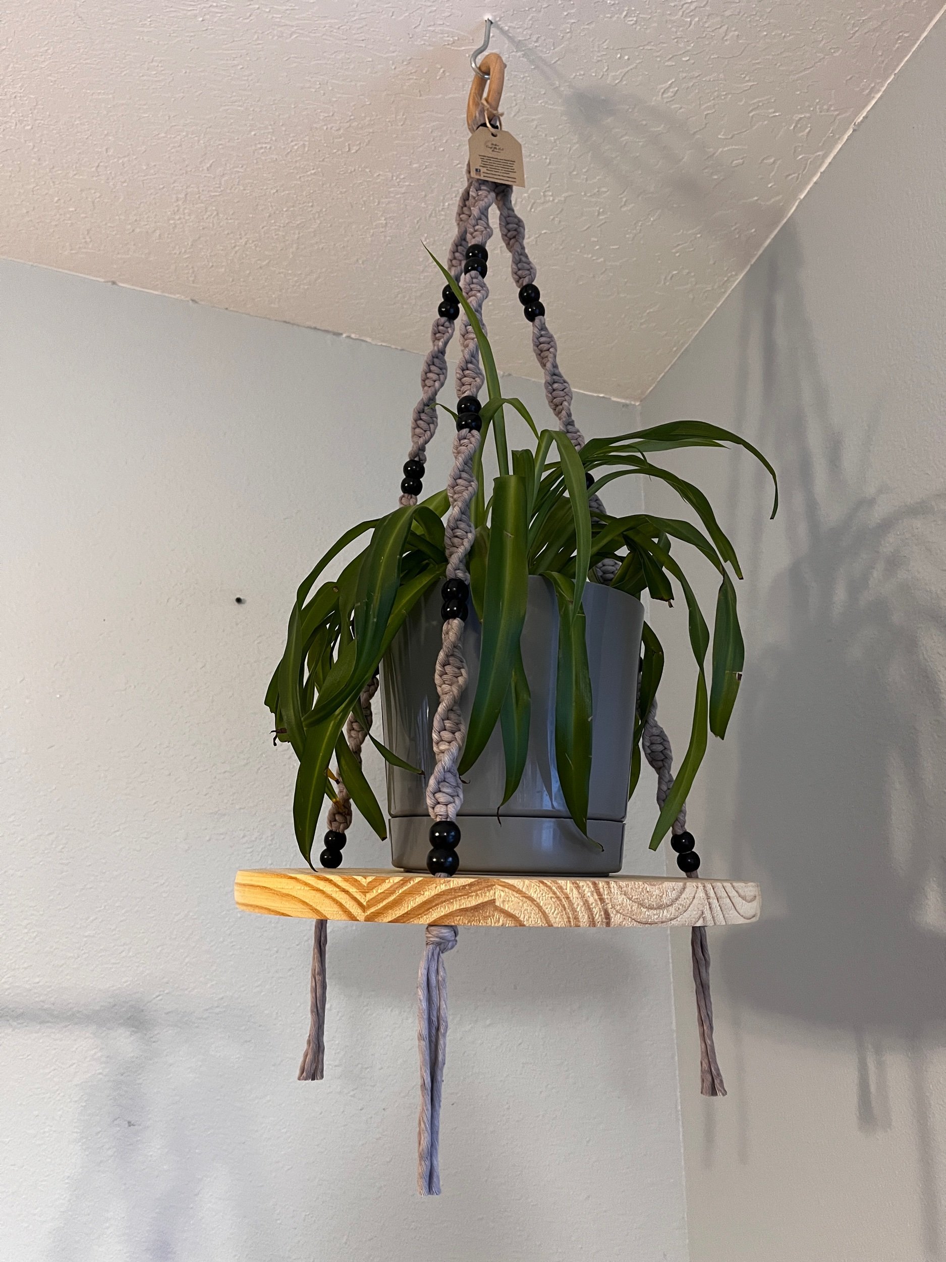 Gray beaded macrame hanging shelf