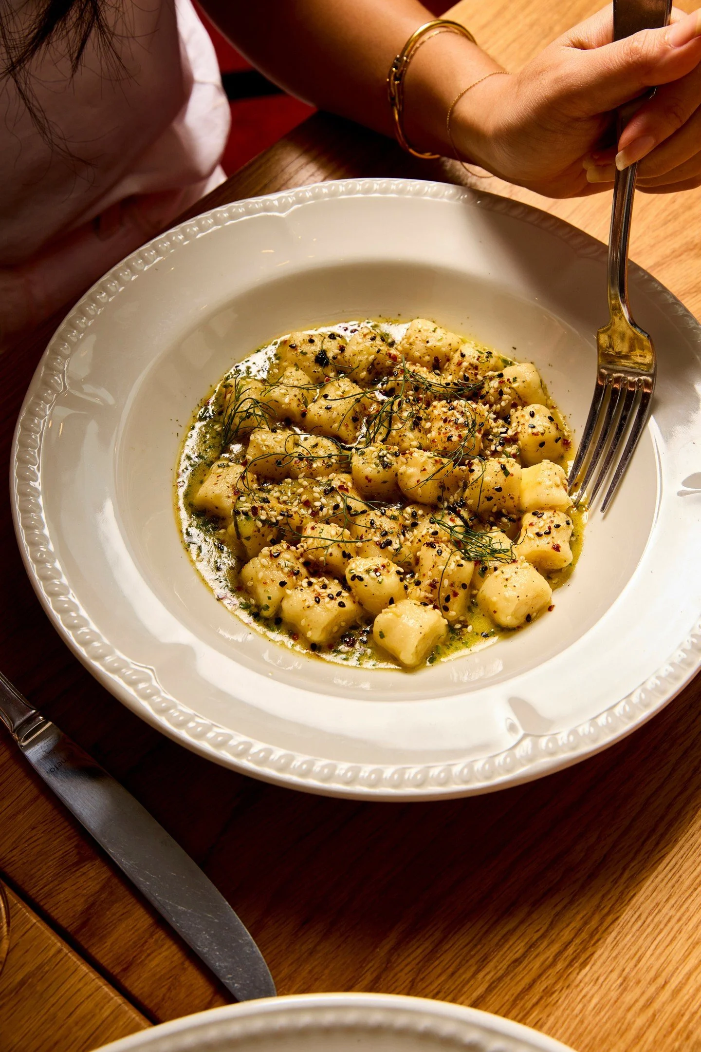 Ricotta gnocchi with yuzu butter, crab, and seaweed furikake. New to the menu.