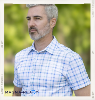 a man modeling a blue and white plaid adaptive short sleeve button down outside