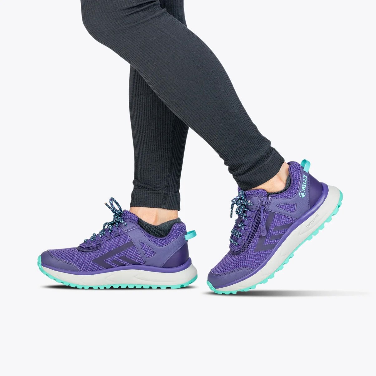 BILLY women's adaptive trail inclusion shoe in purple/mint shown on a woman wearing black leggings