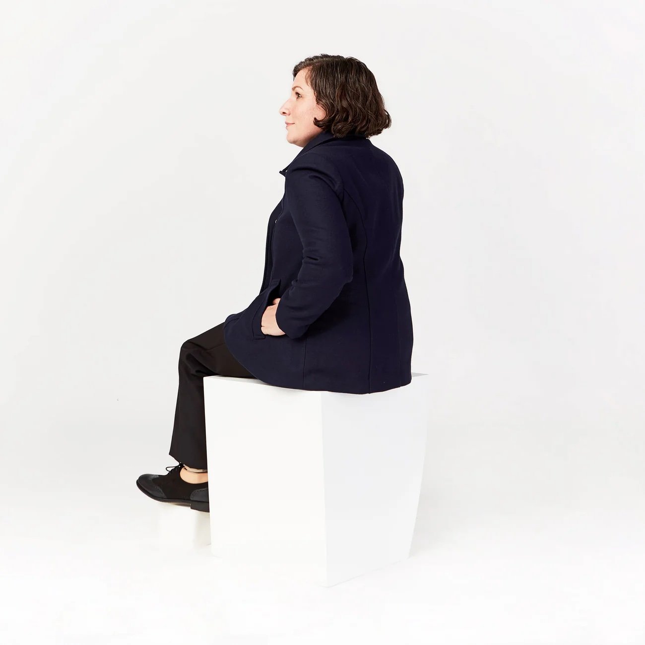 iz_adaptive_womens_peacoat_sitting.jpeg