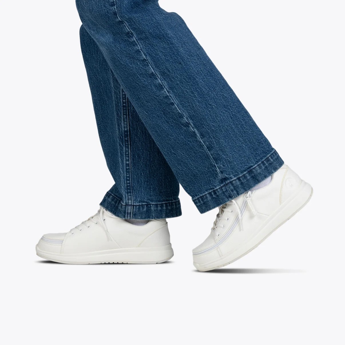 BILLY adaptive womens low top white work shoe on a woman wearing jeans