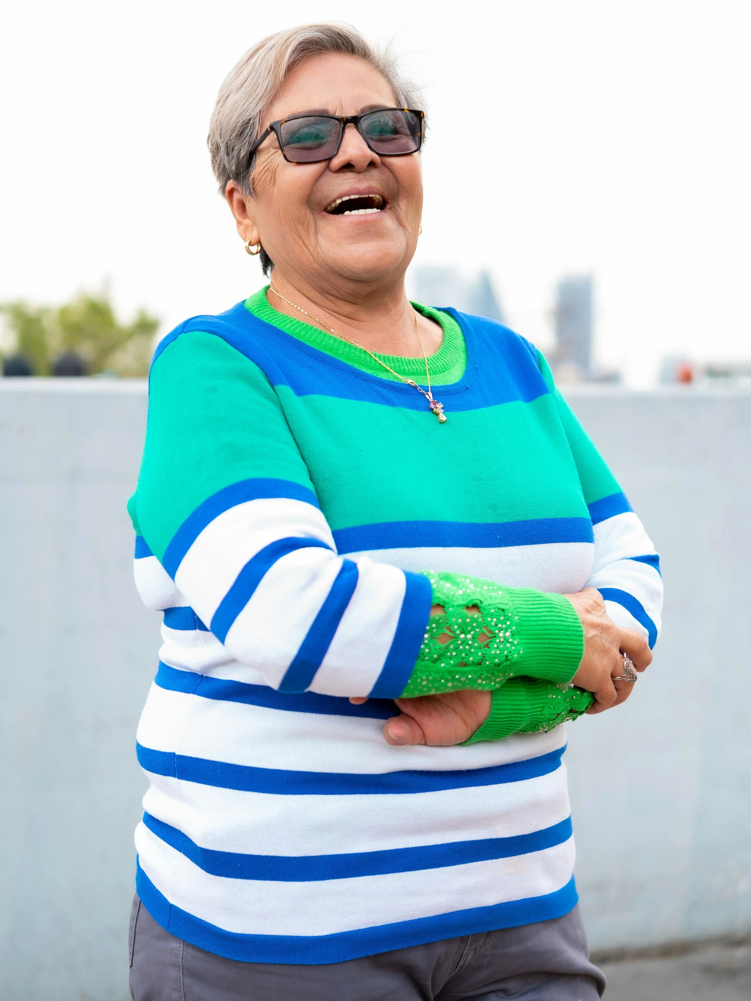 Middle aged woman laughing.