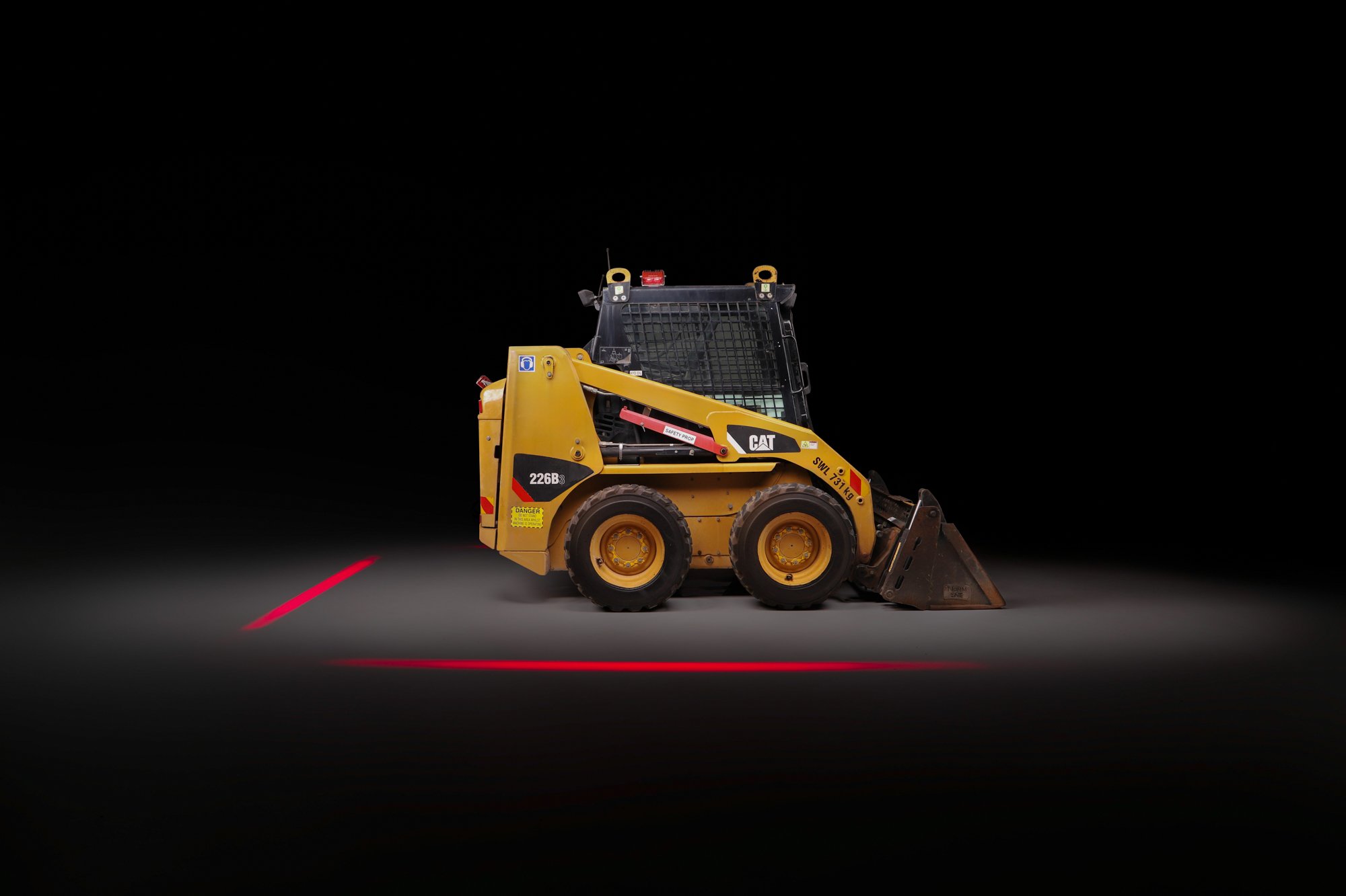 Skid steer loader surrounded by Safety Halo™ exclusion zone by Incident Zero