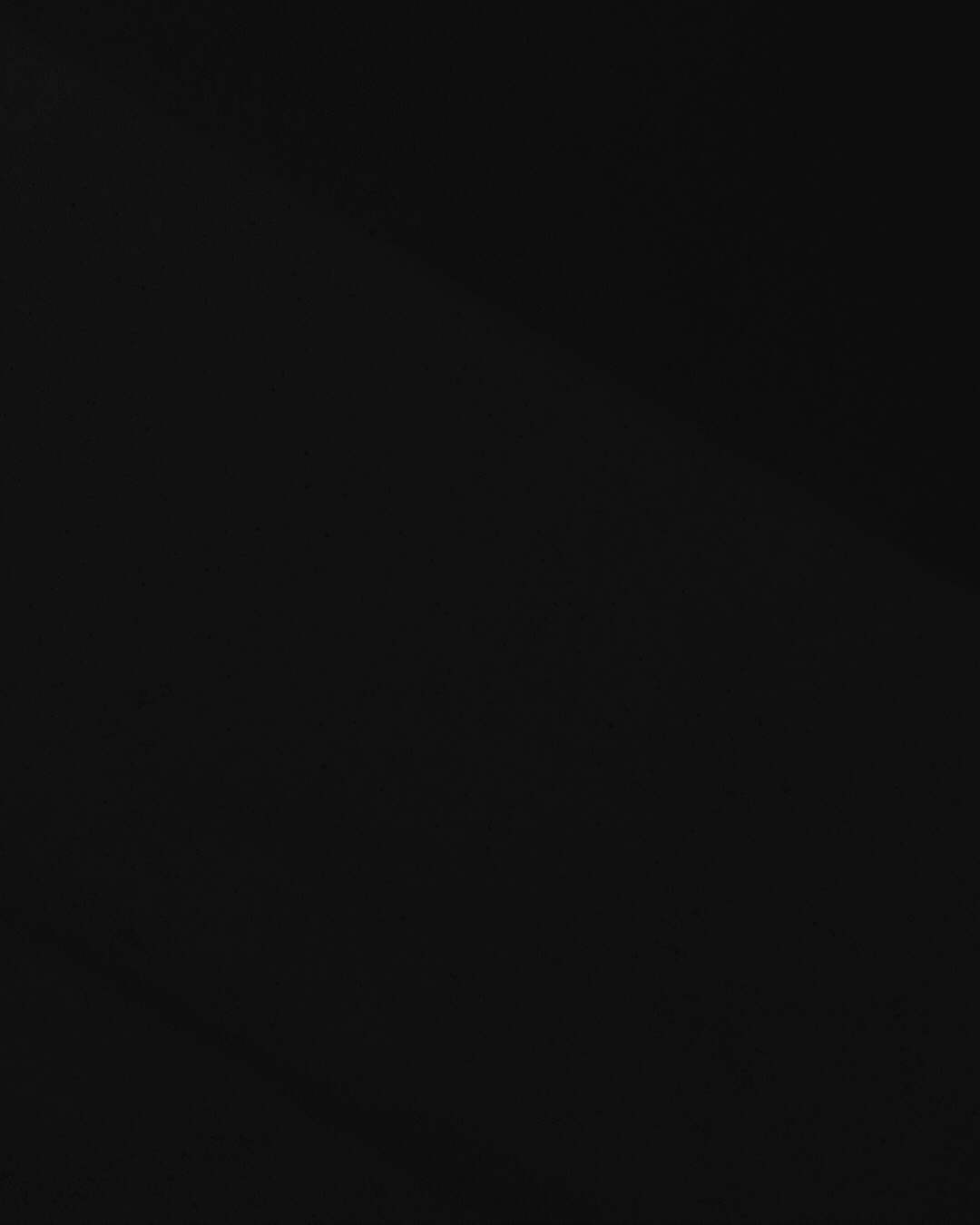 Black screen with no visible objects or details.