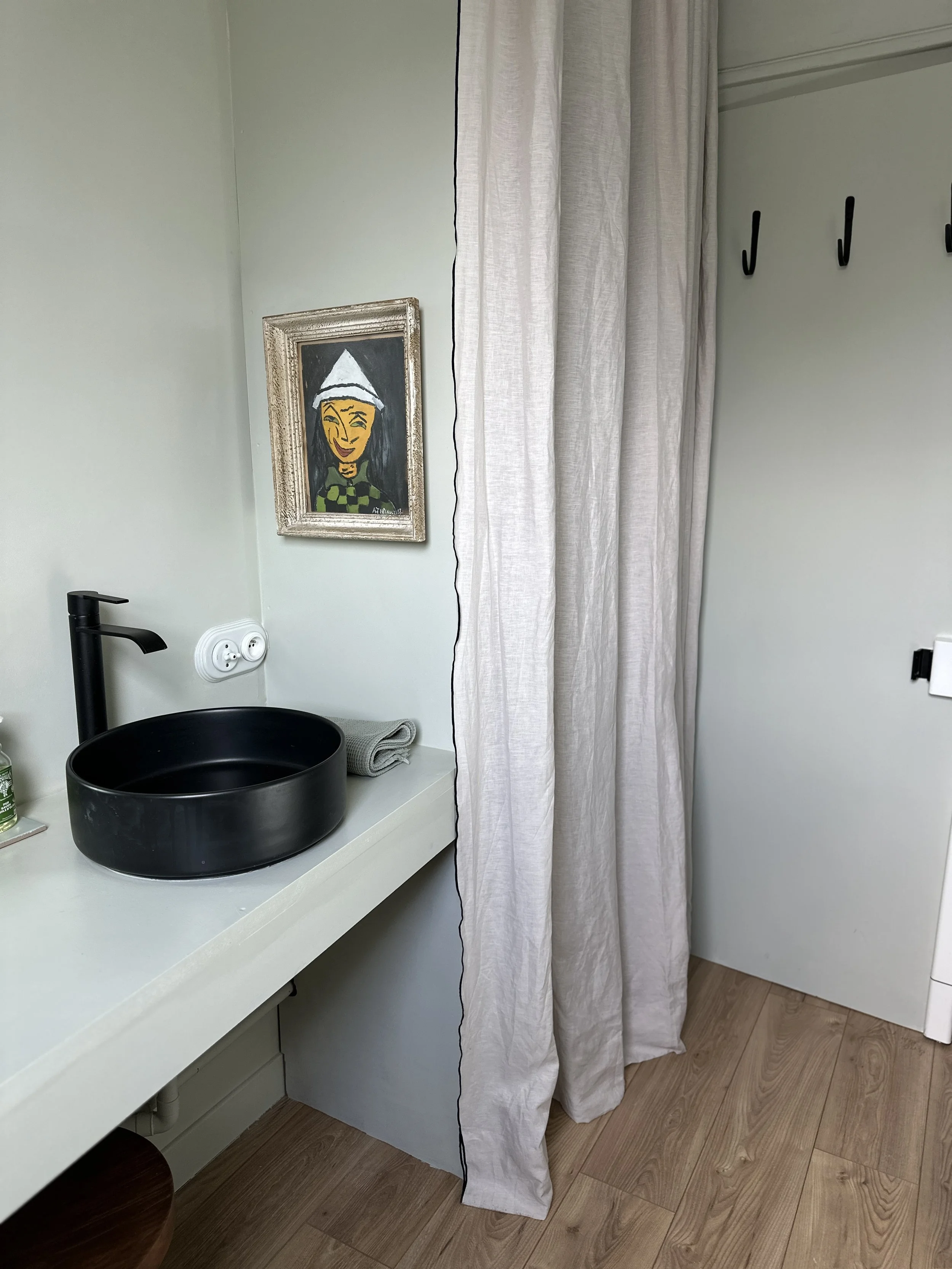 Minimal sink area in a renovated tiny studio.
