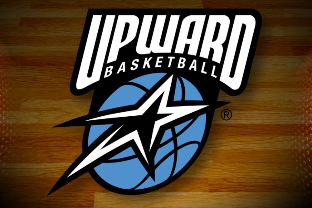 Logo of Upward Basketball with a star, basketball, and text on a wooden background.