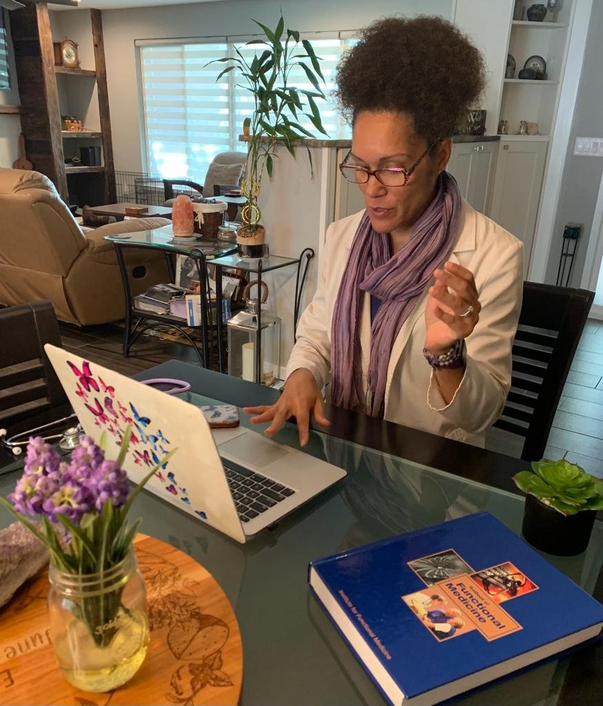 Dr. Anya Szigeti reviewing root-cause functional medicine care plan personalized current patient follow up