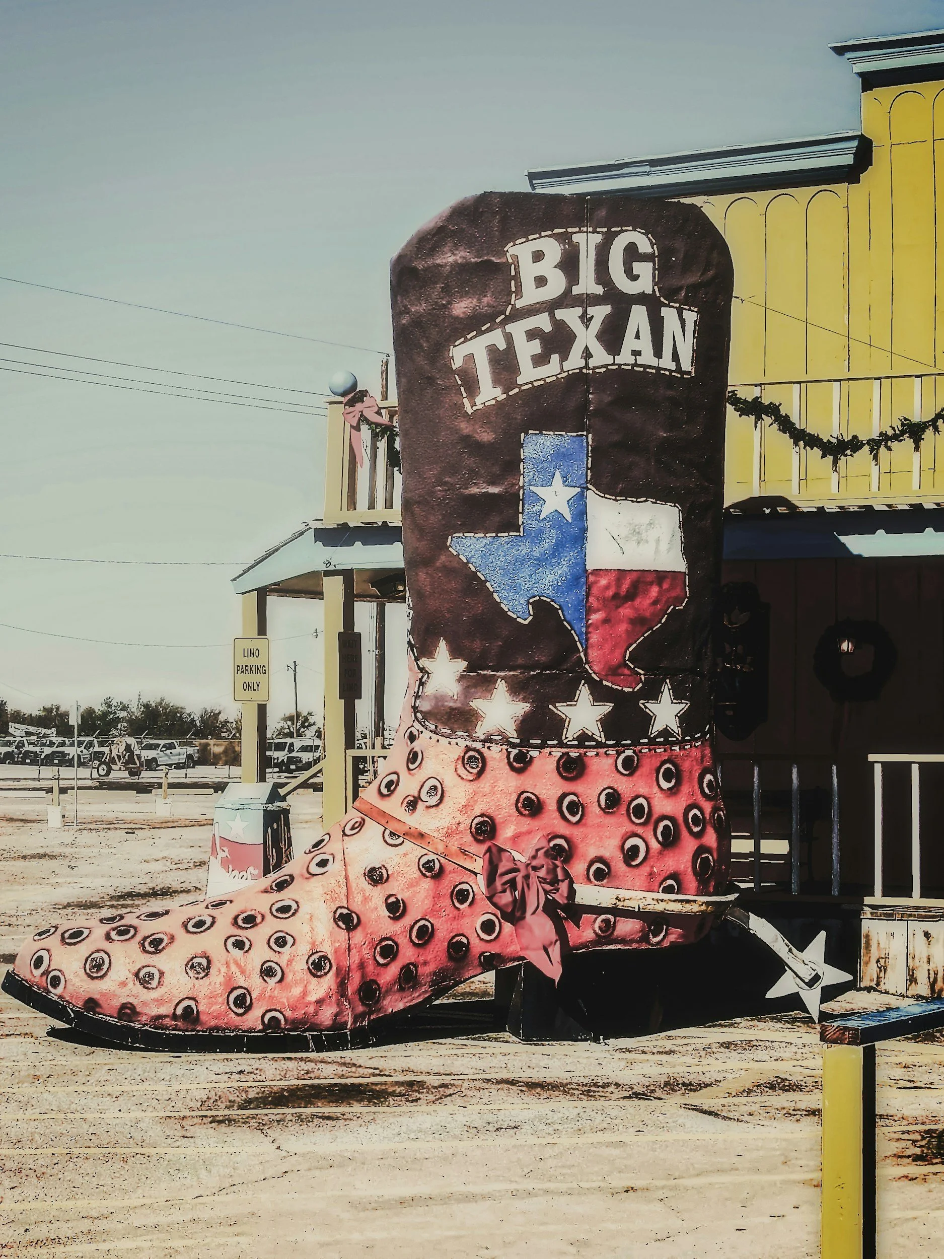Decorative boot-shaped sign with Texas flag colors reading 'Texan'.