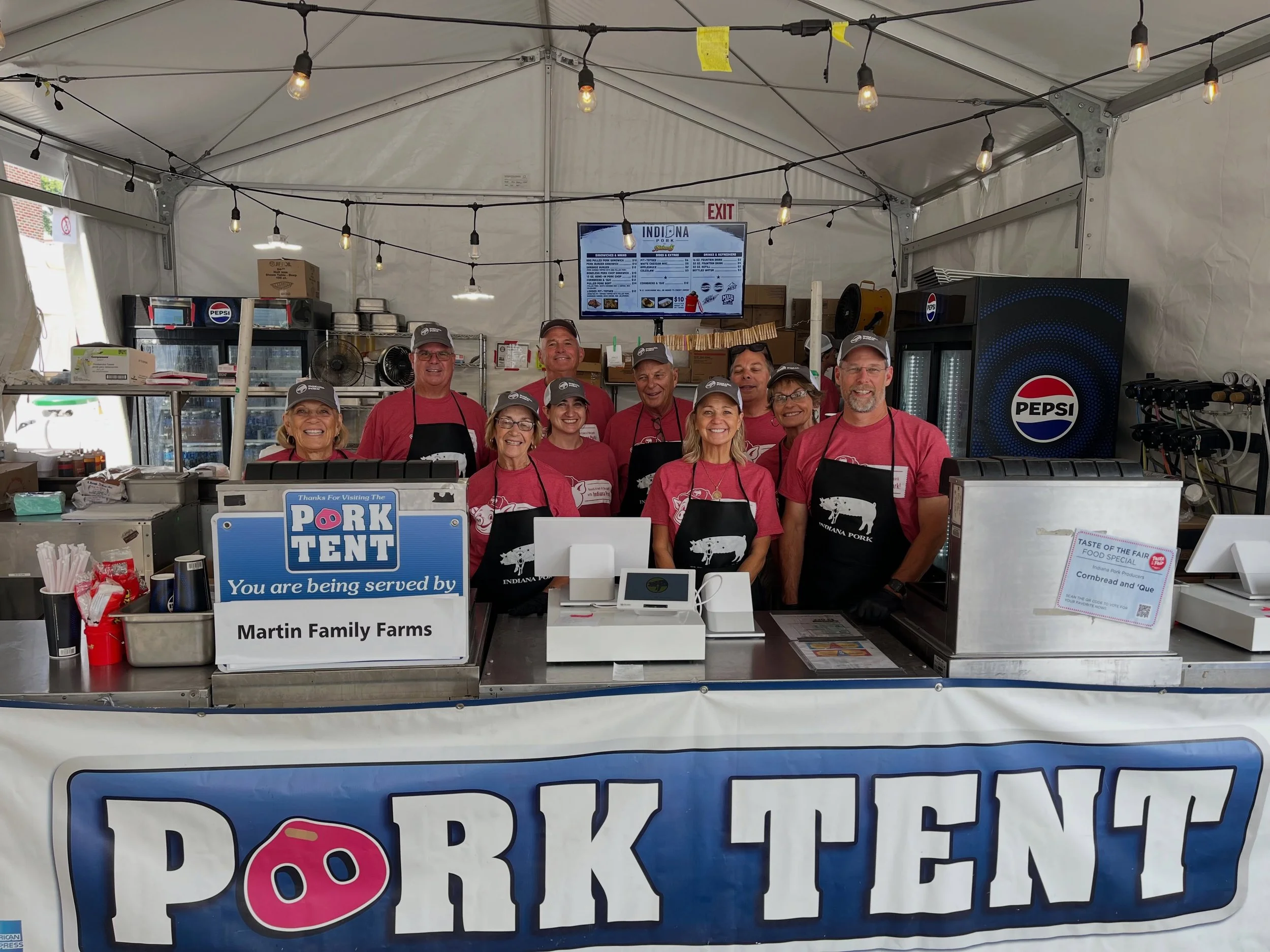 People working inside a concession tent