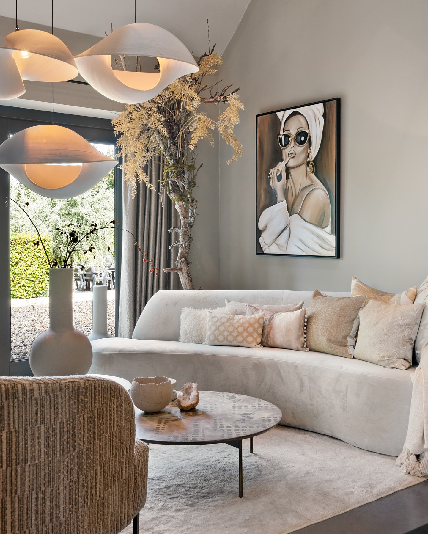 Capturing timeless elegance with the iconic Audrey Hepburn 💄🕶️ With her lipstick poised and chic sunglasses adorning her, she stands out against the sepia backdrop with taupe hues, seamlessly blending into any stylish interior with its sepia tones.