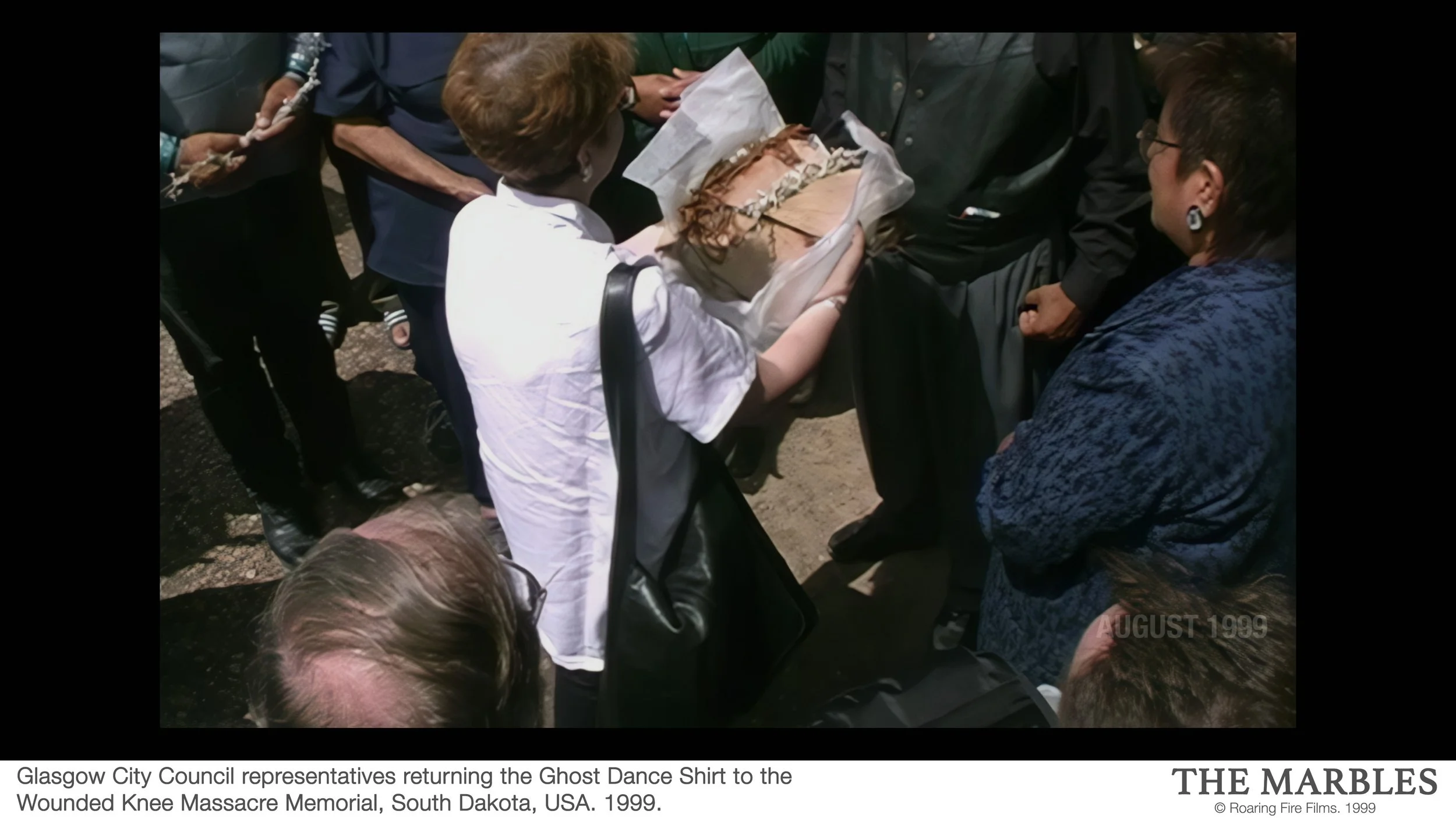 0012 Glasgow City Council representatives returning the Ghost Dance Shirt to the Wounded Knee Massacre Memorial, South Dakota, USA. 1999.jpg