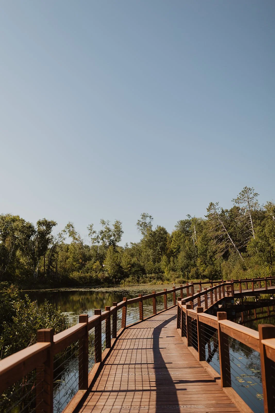 Boardwalk crossing Milford Lake at Milford Mine Memorial Park in Crosby, MN