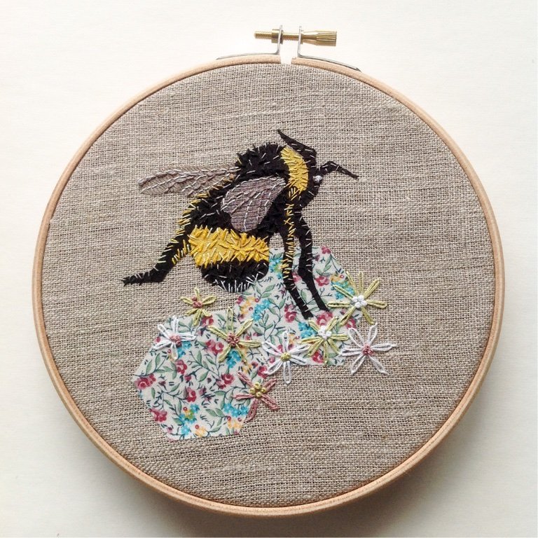 Hand embroidered bee stretched on a ring