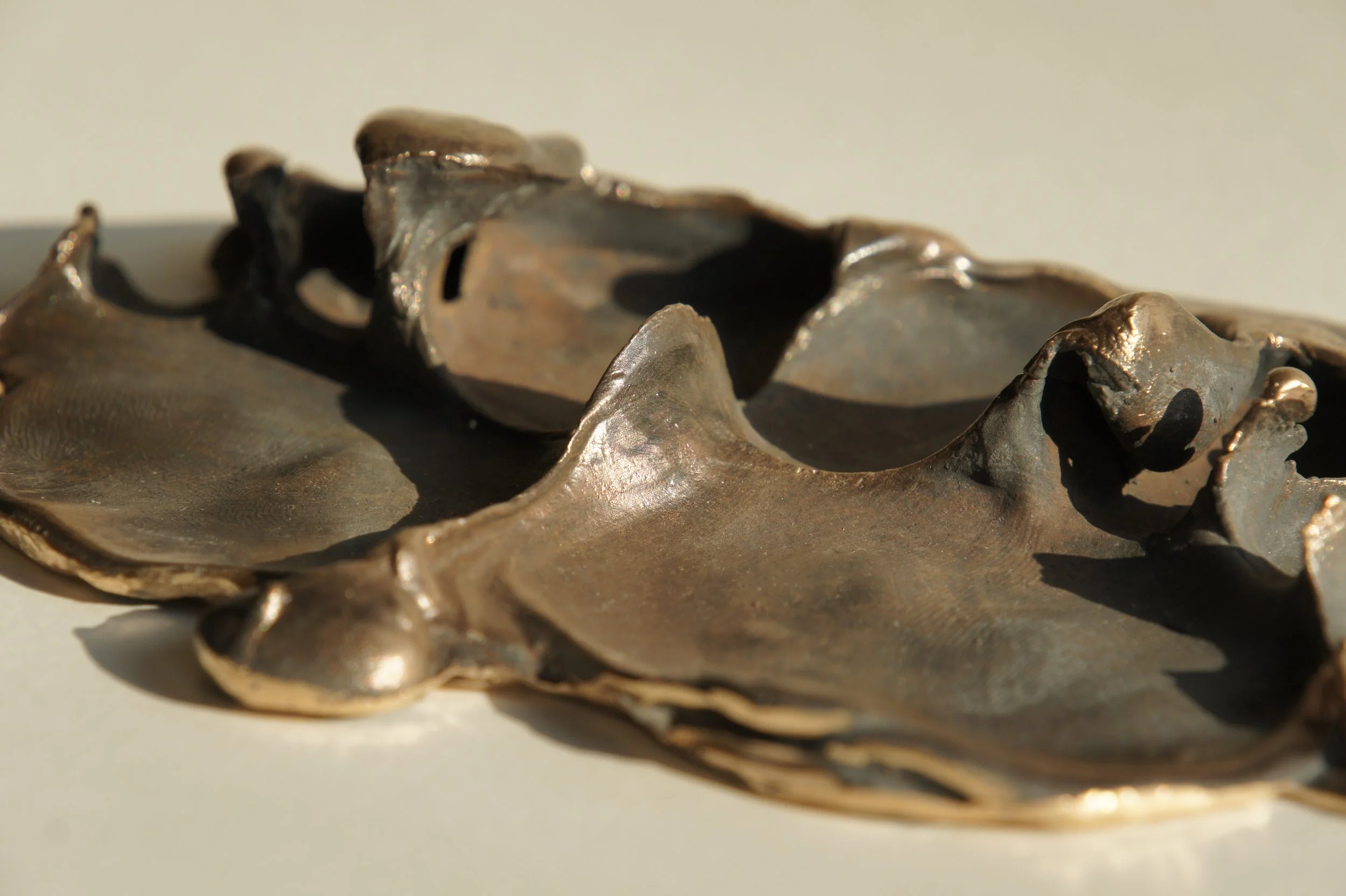 Squeezing through my fingers / Pressing through my toes