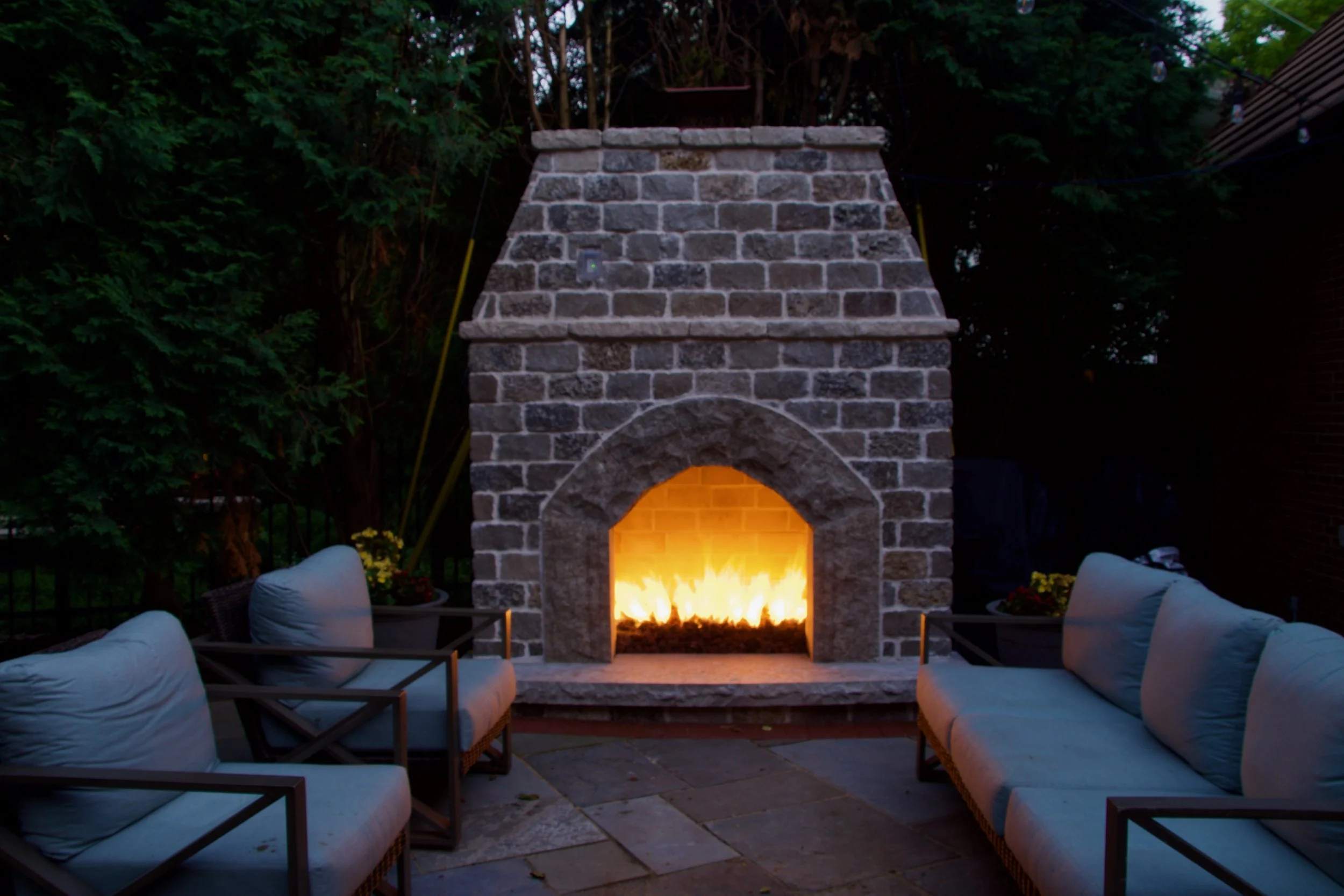 outdoor gas fireplace, custom built with natural stone