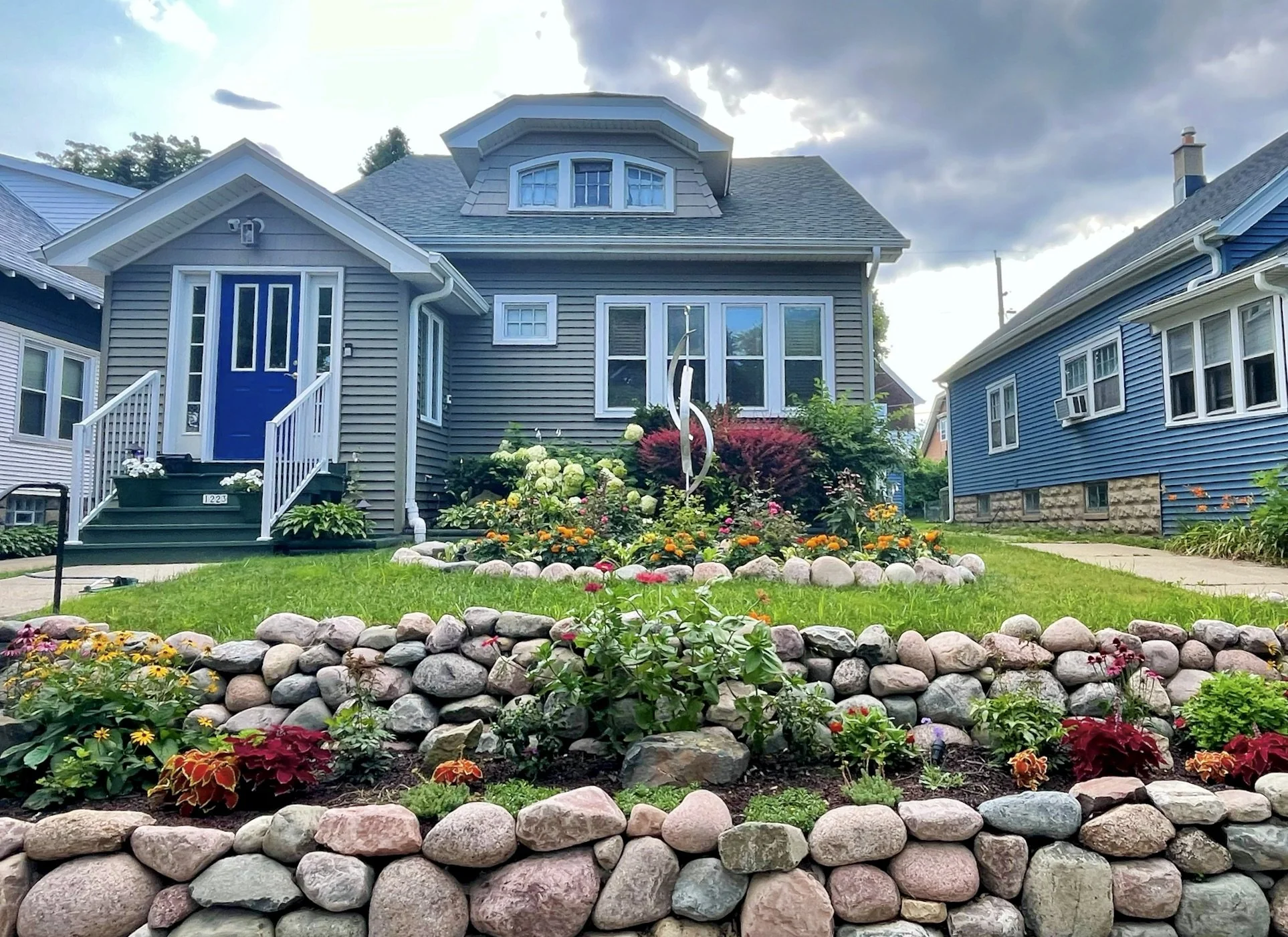 fieldstone retaining wall with garden beds