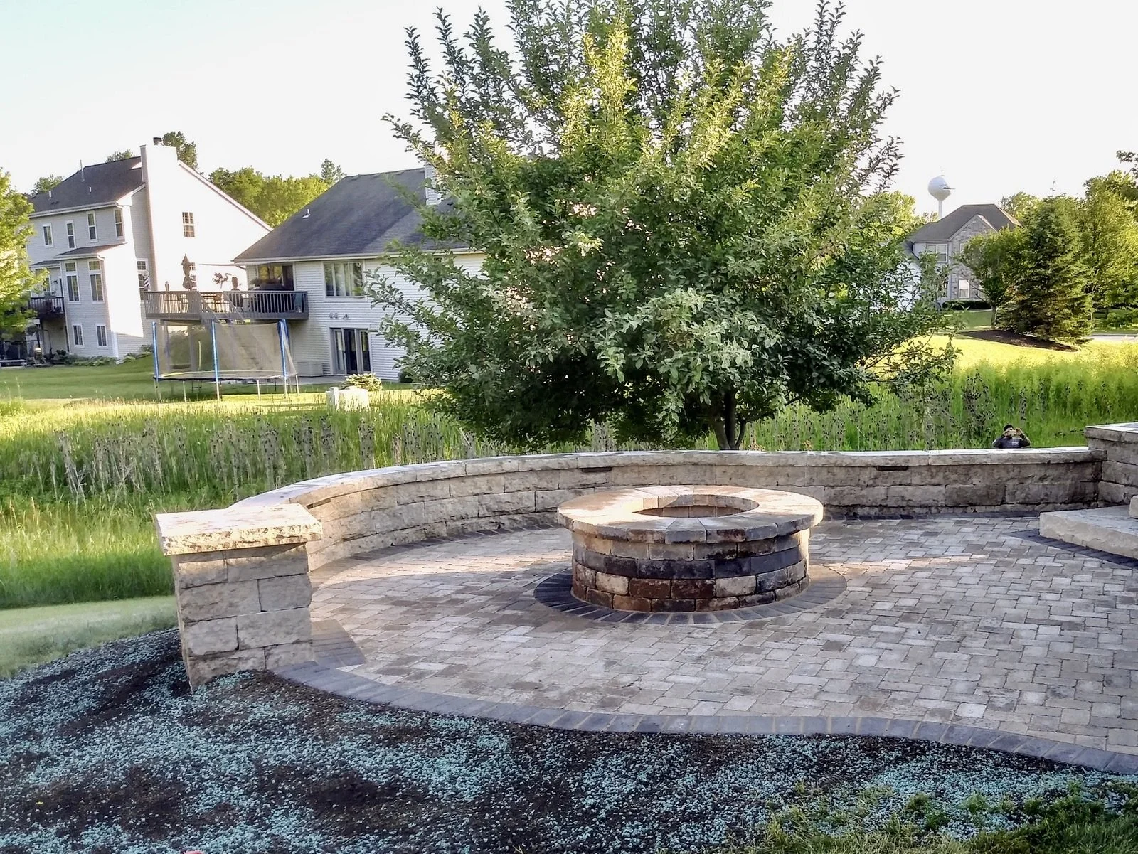 outdoor wood burning stone firepit, Stone seat wall and patio