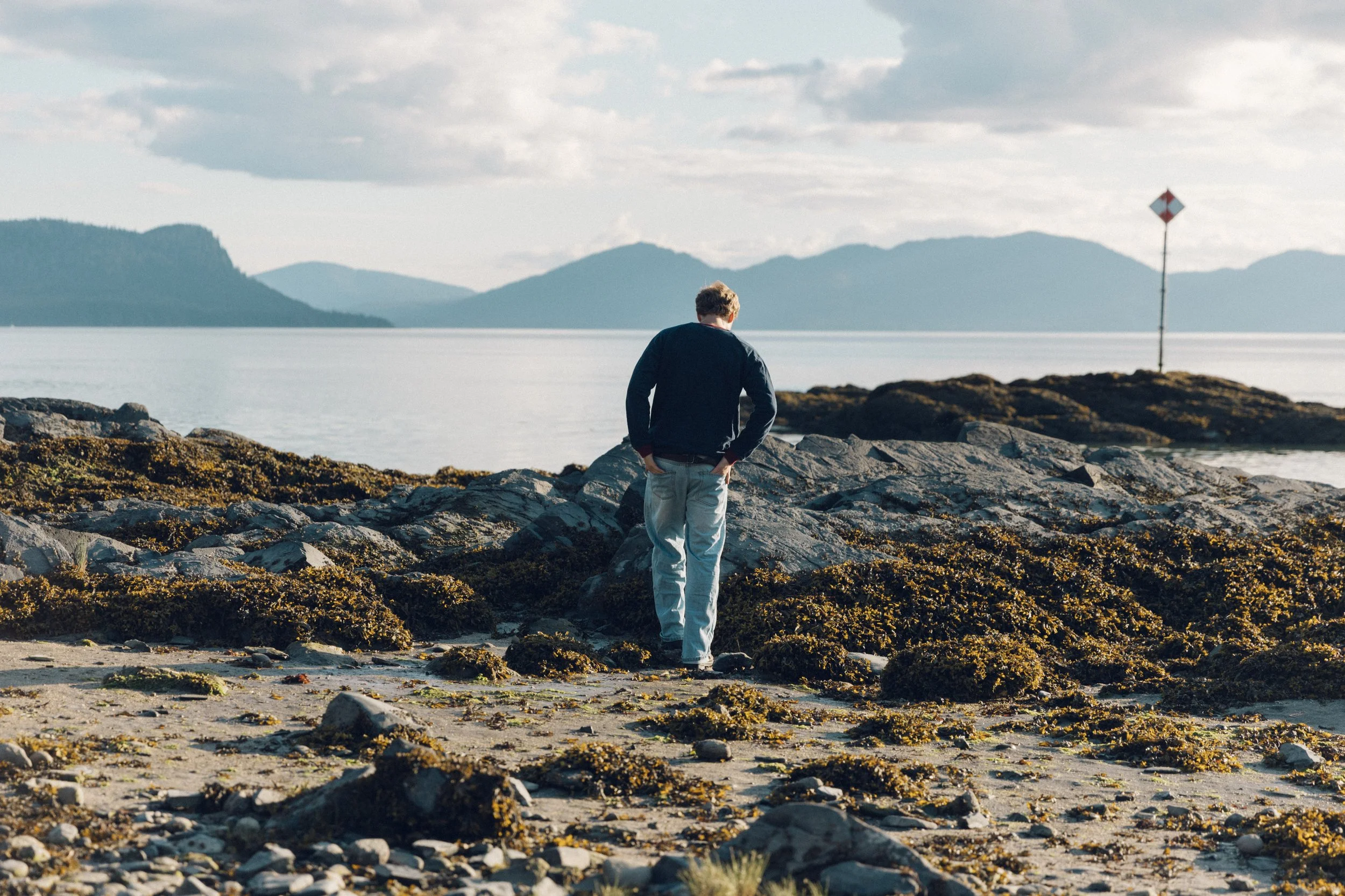Exploring Petroglyph Beach during low tide at Wrangell, Alaska.
