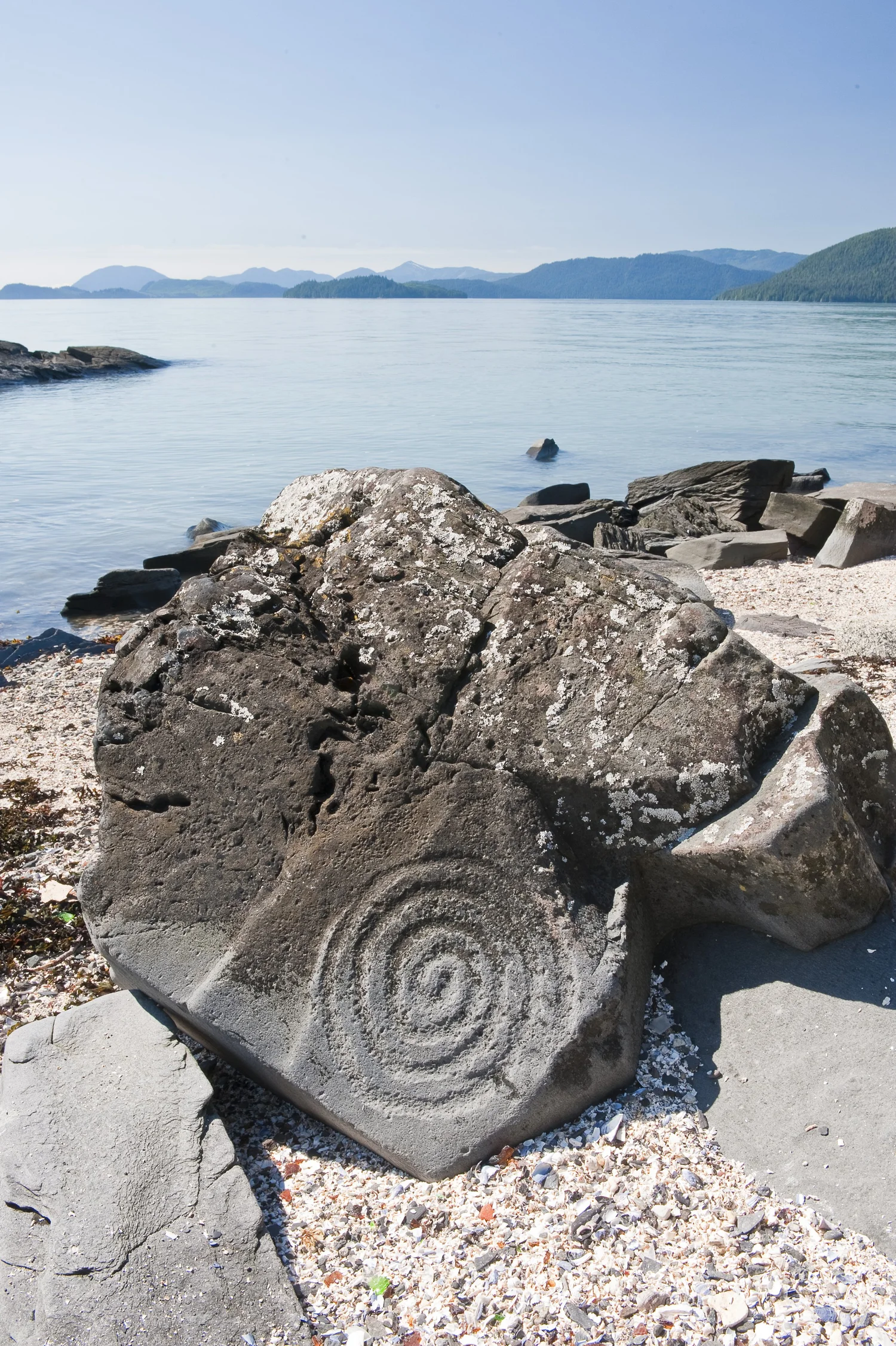 Close-up view of a petroglyph carved into a rock at Petroglyph Beach in Wrangell, Alaska. Courtesy @travelwrangell.