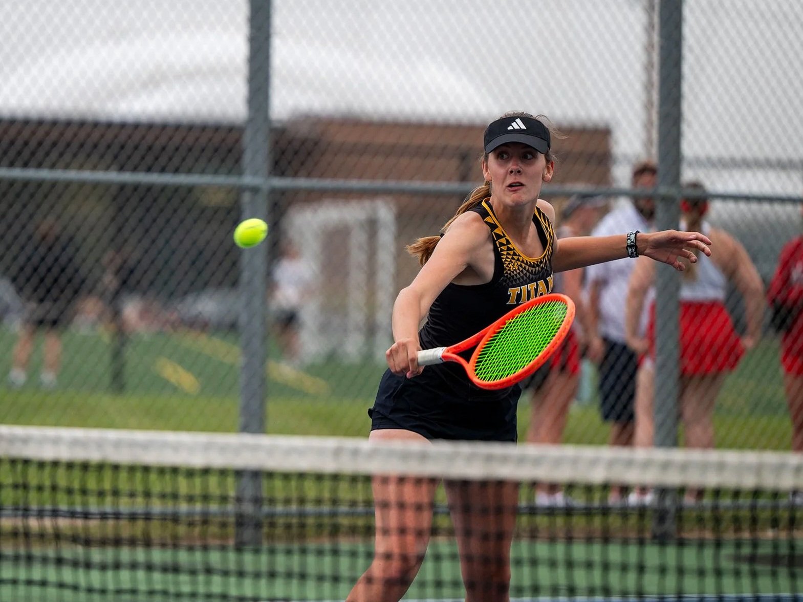 UWO’s Bre Schultz volleys the ball over the net in a match at the Kolf Sports Center Outdoor Tennis Courts in Oshkosh, Wis., on Sept. 10, 2025. Schultz won her match 2-0 against Ripon's Allison Pavlovec.