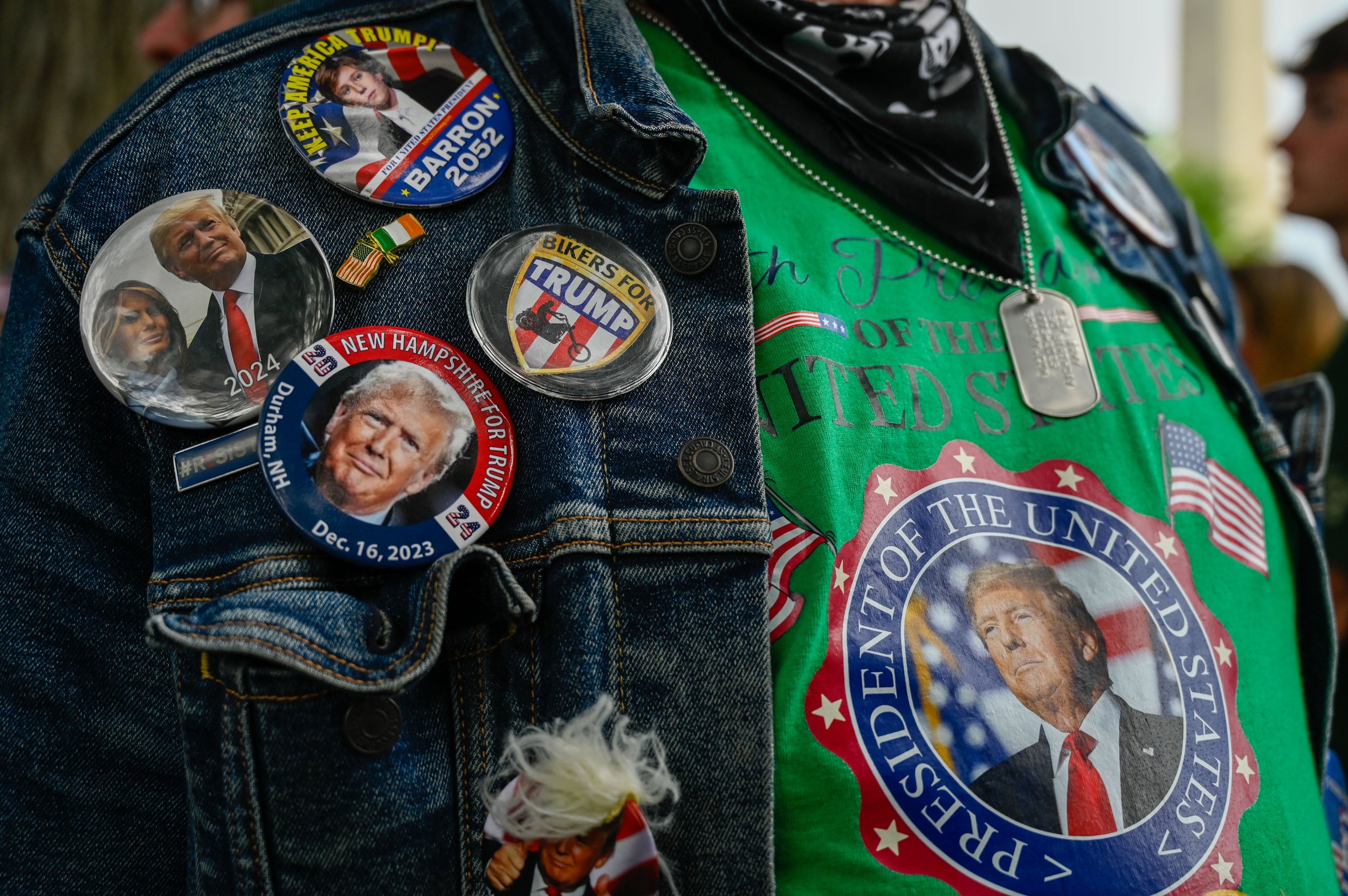 A man shows off his pro-trump merch during the Army's 250th birthday celebration in Washington, D.C., on June 14, 2025. The man said he had not served in the Army, and that the dog tags were from a souvenir shop.