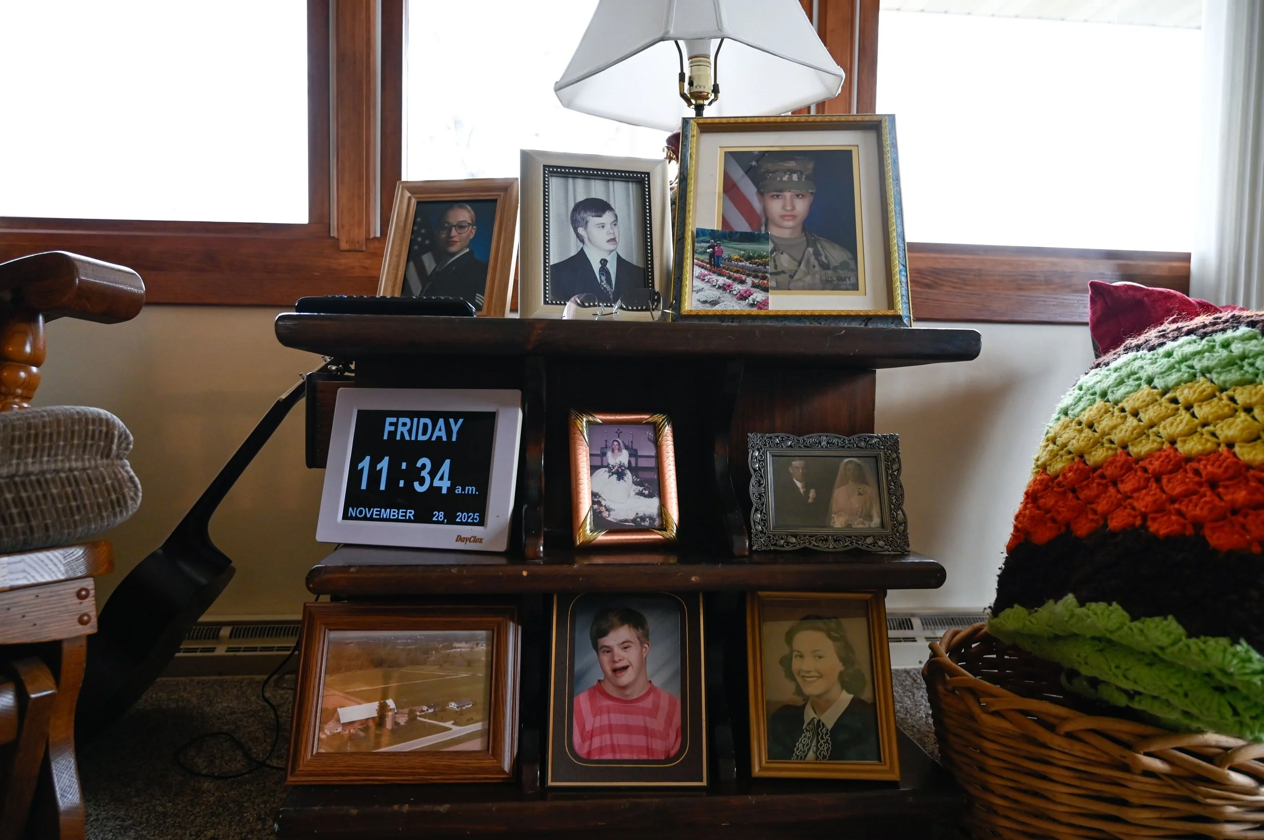 Pictures of Chad are displayed among other family photos throughout Janet's house in New London, Wis., on Friday, Nov. 28, 2025.