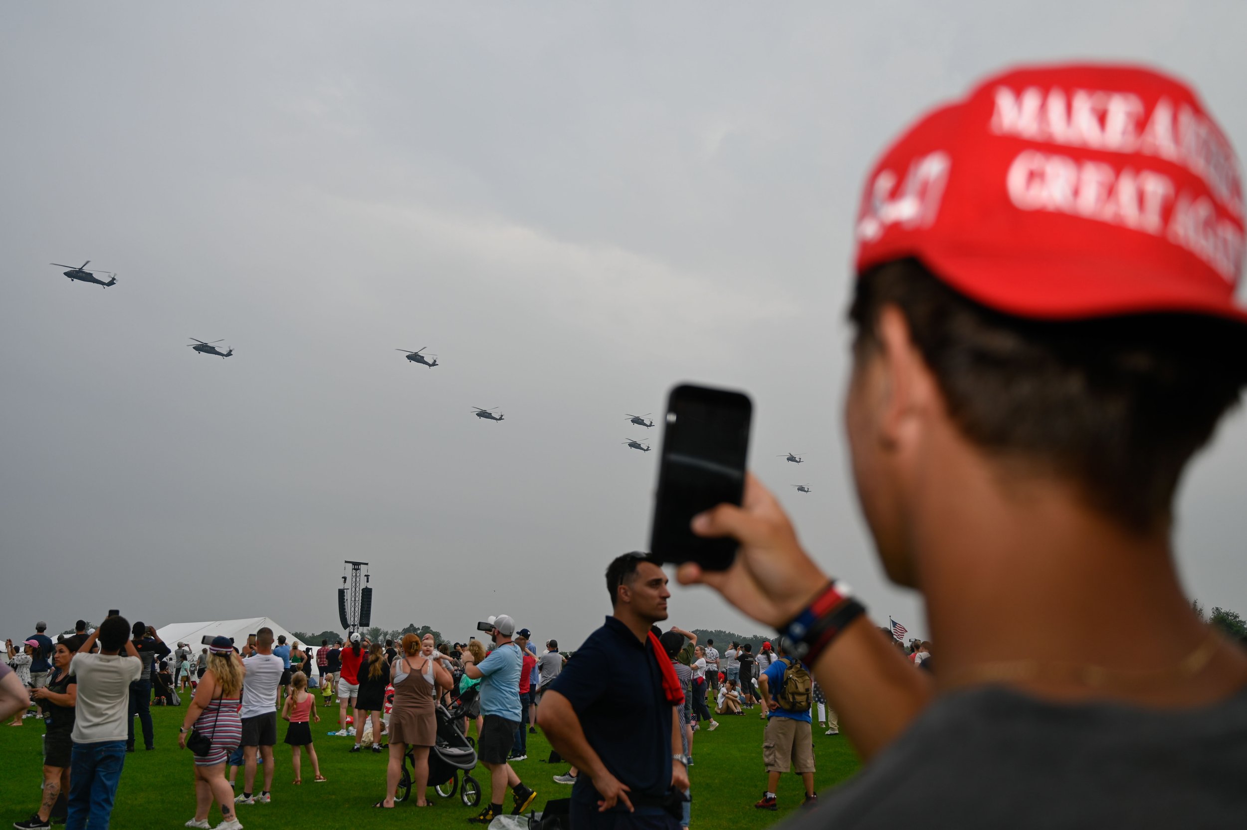 A man takes photos of aircraft during the Army's 250th birthday celebration in Washington, D.C., on June 14, 2025.
