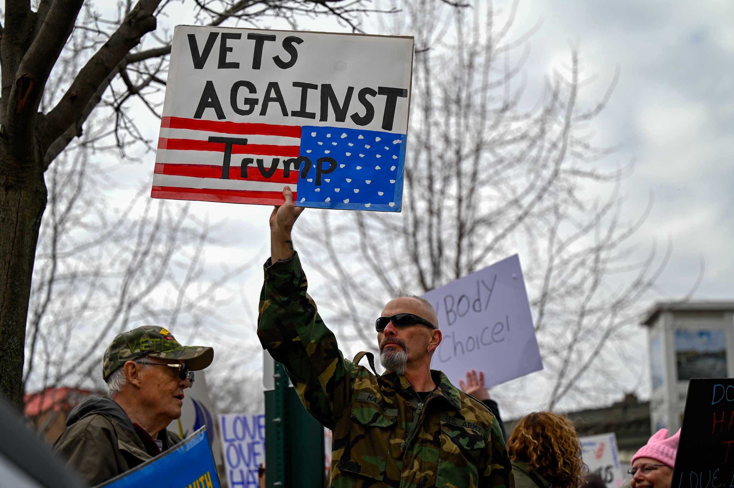 Veterans hold signs in protest at Houdini Plaza in Appleton, Wisconsin, on April 5, 2025. The "Hands Off!" protest was originally started by Indivisible, an activist group that opposes President Donald Trump and supports progressive policies. (Photo